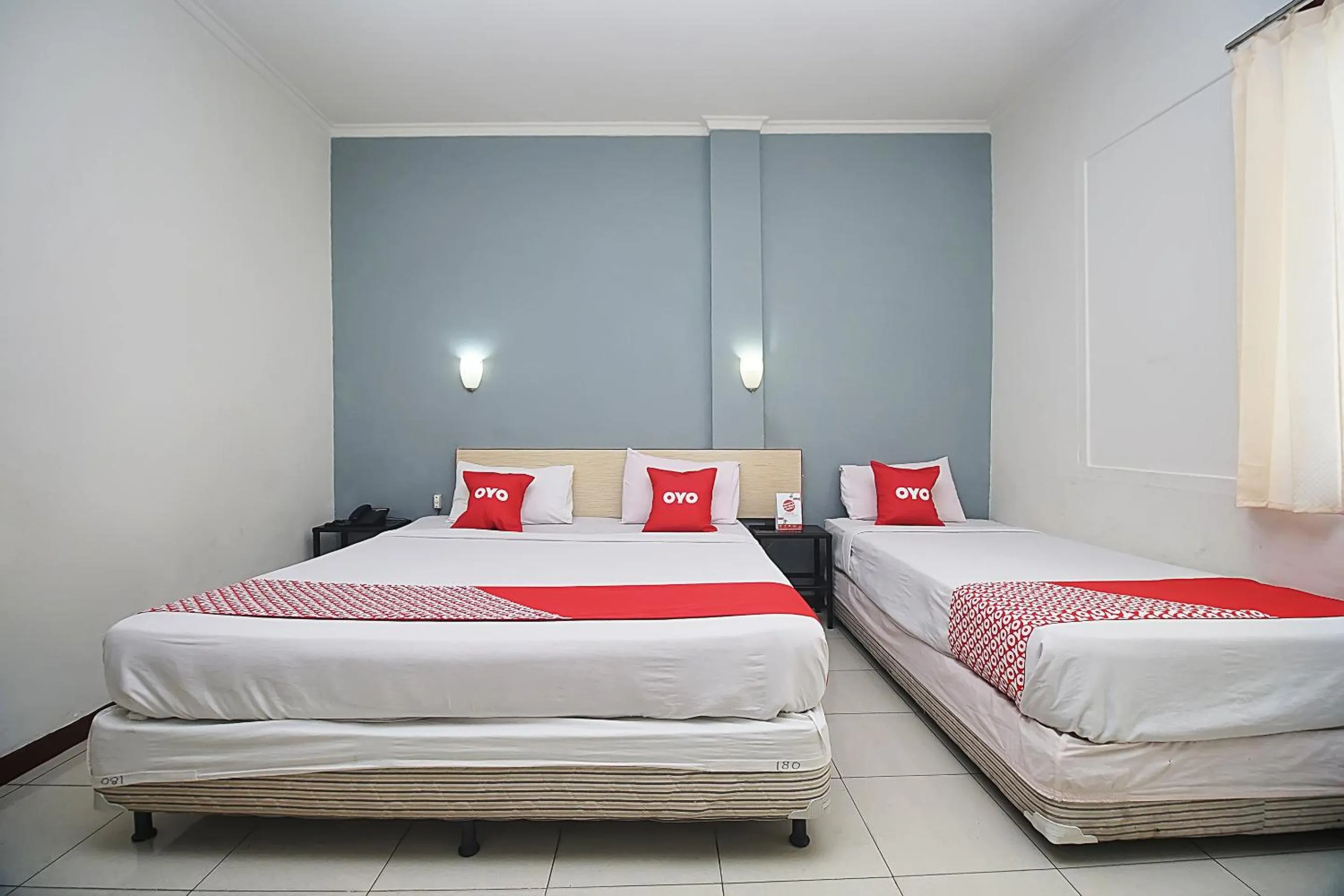 Bedroom in OYO 2079 Jambi Raya Hotel