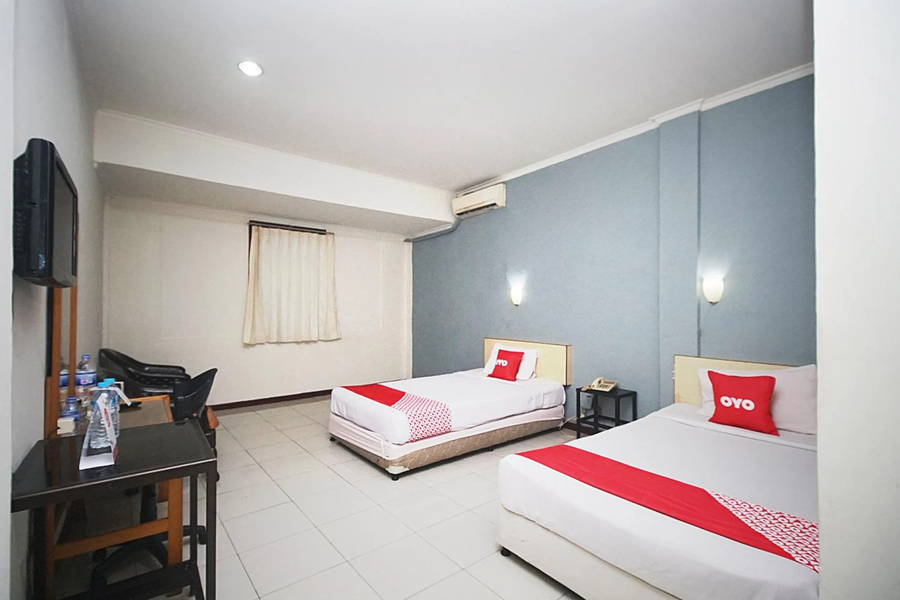 Bedroom in OYO 2079 Jambi Raya Hotel