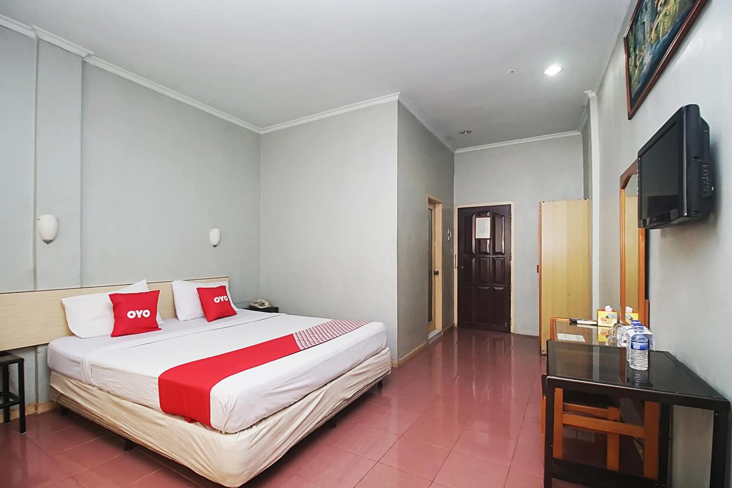 Bedroom in OYO 2079 Jambi Raya Hotel