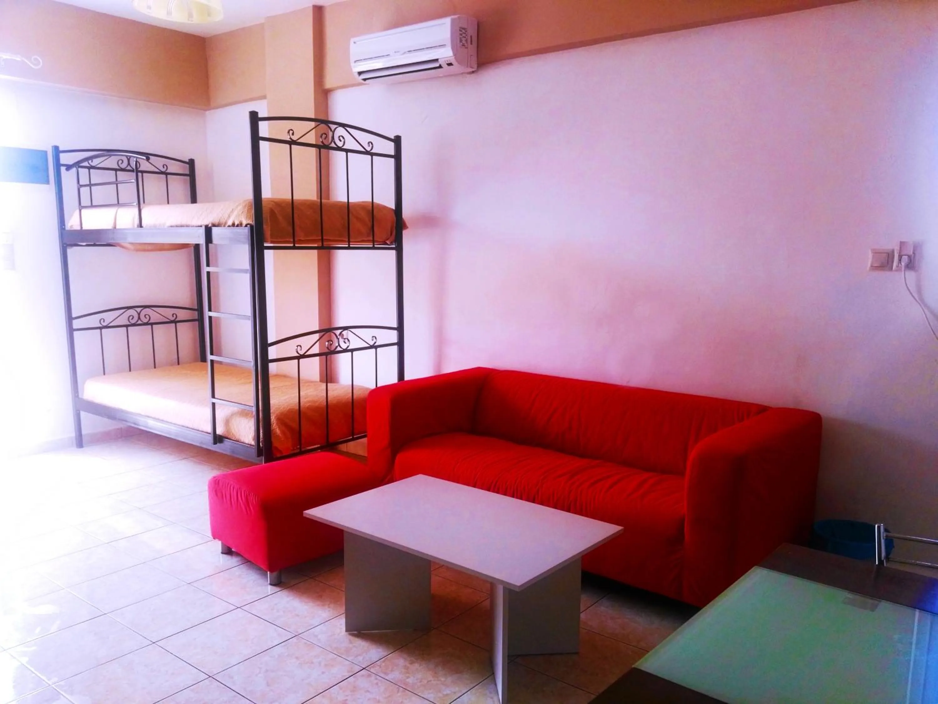 Seating area, Bed in Baladinos Apartments