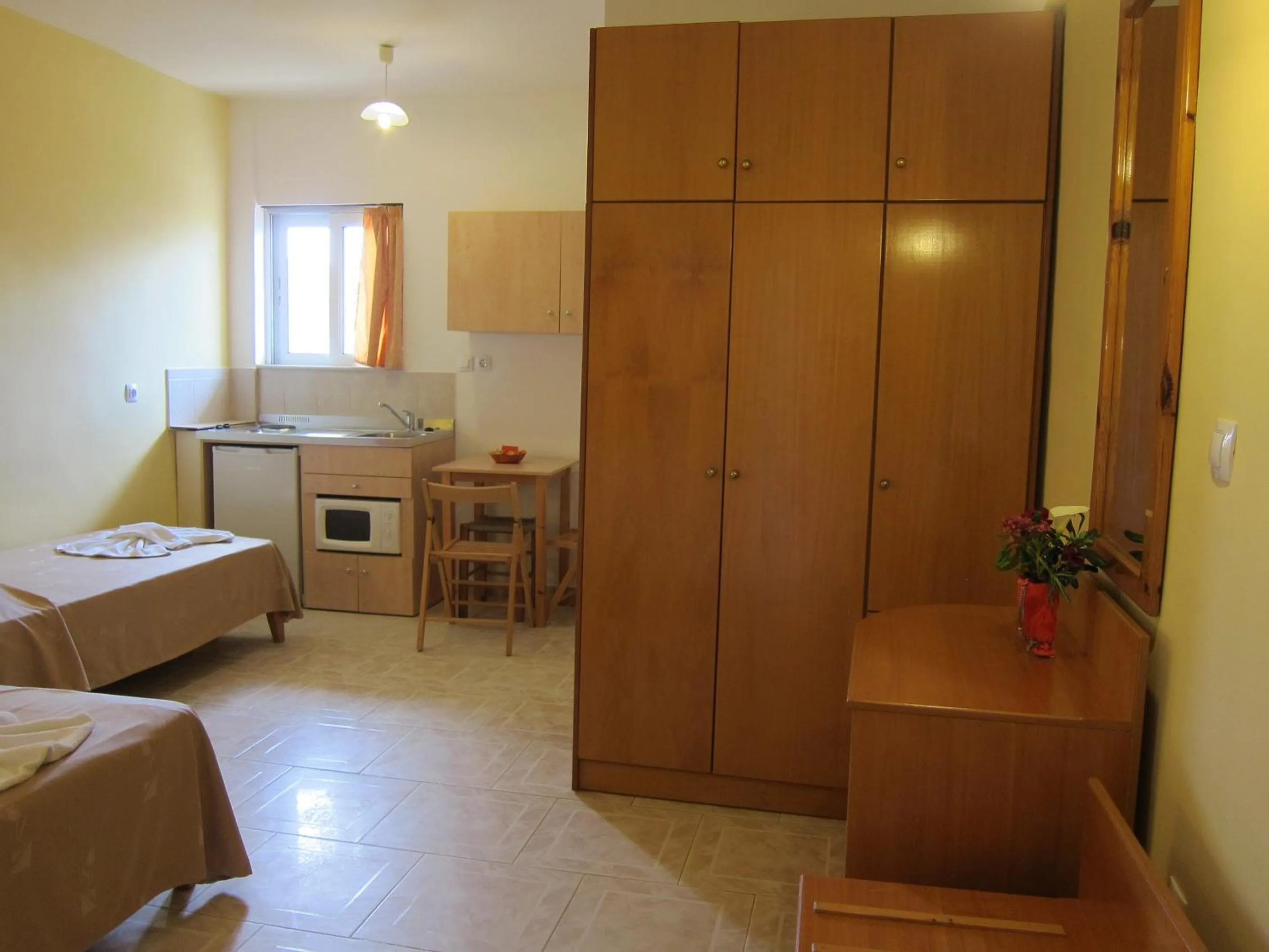 Kitchen or kitchenette, Bed in Baladinos Apartments