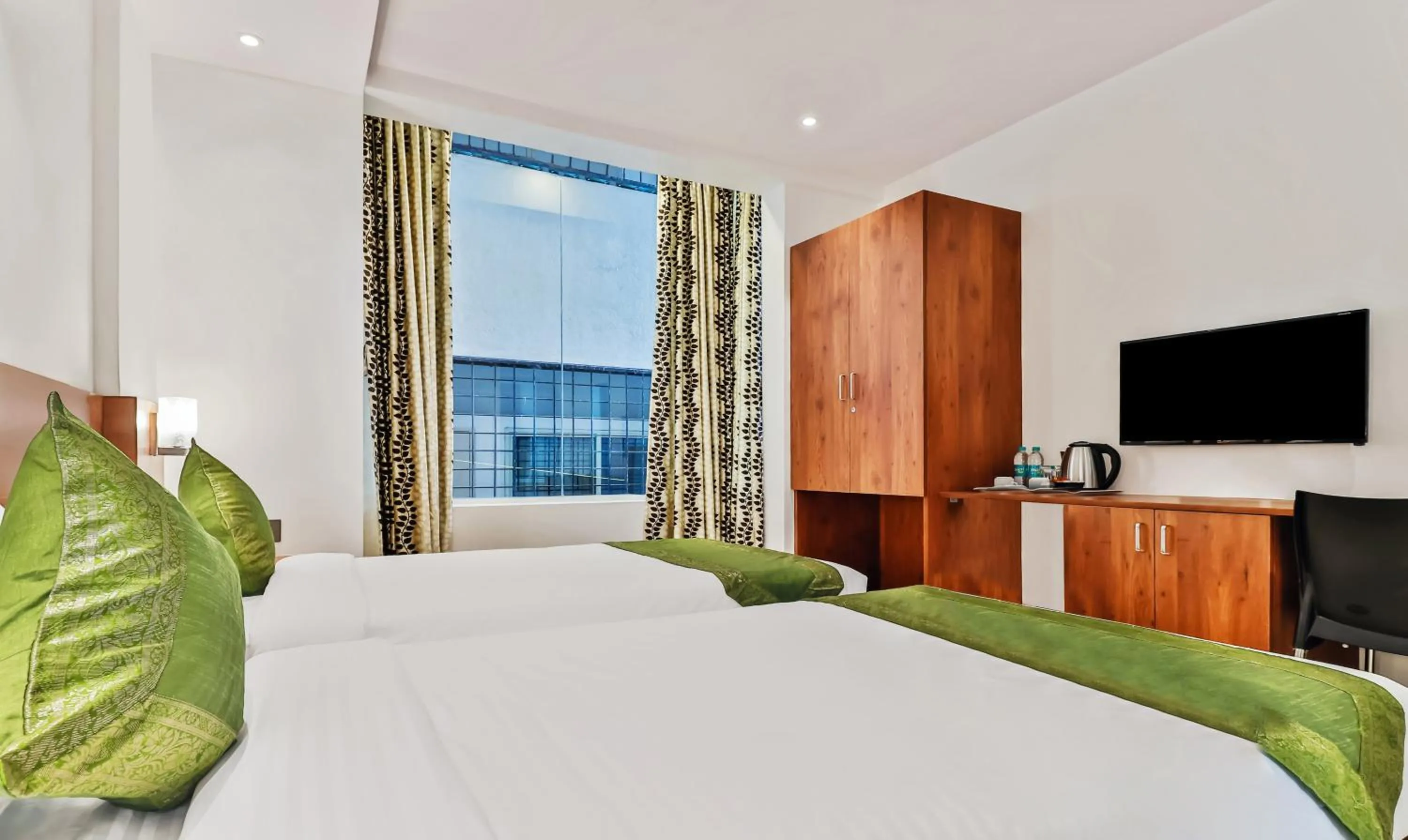 Bedroom, Bed in Treebo Blu Orchid