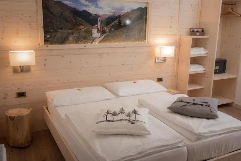 Bed in Garni Le Prealpi
