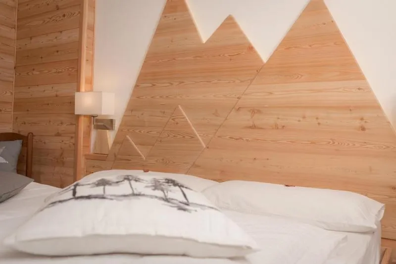 Bed in Garni Le Prealpi