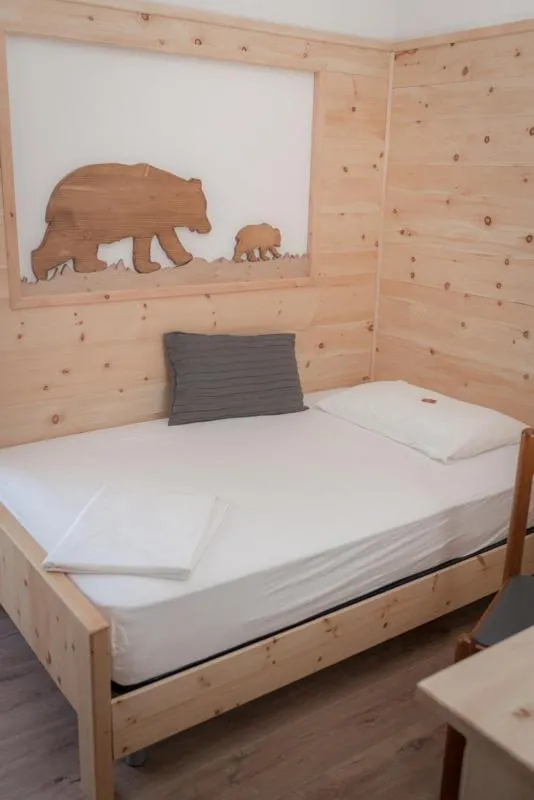 Bed in Garni Le Prealpi