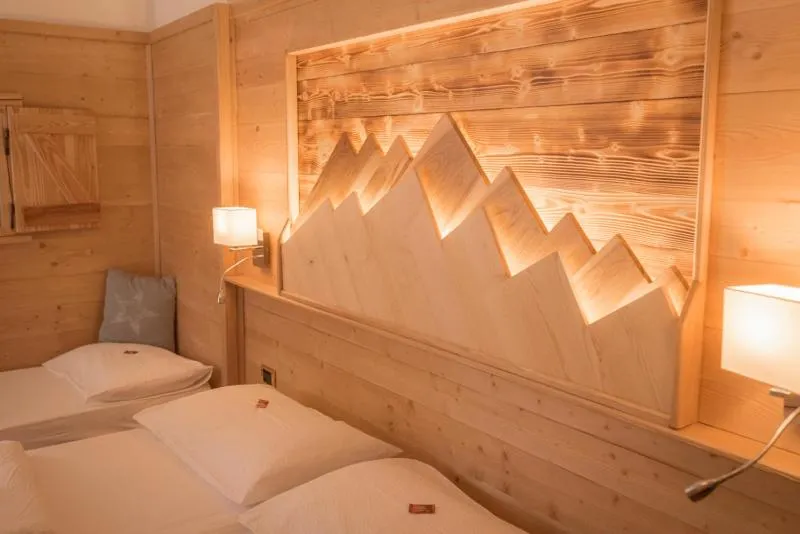Bed in Garni Le Prealpi
