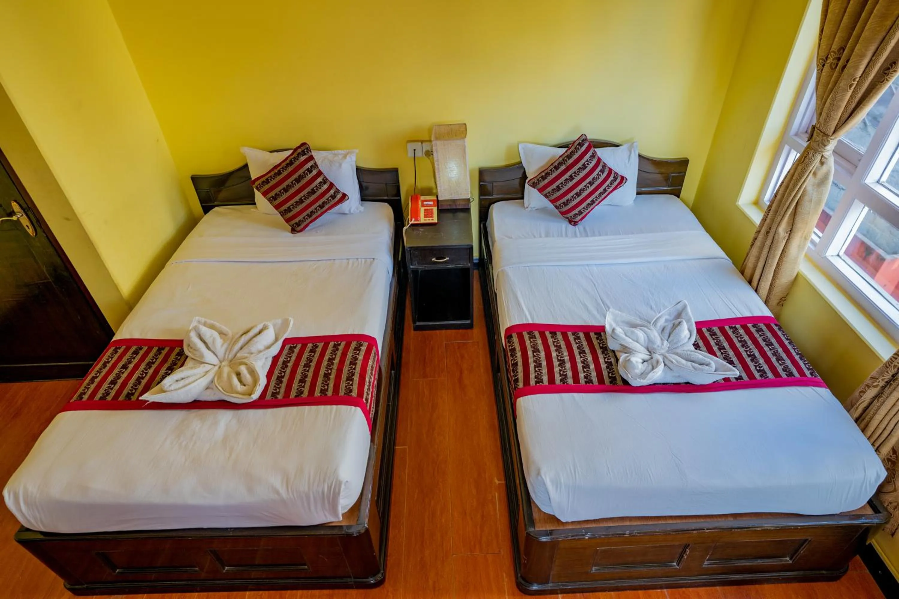 Bed in Hotel Bougainvillea