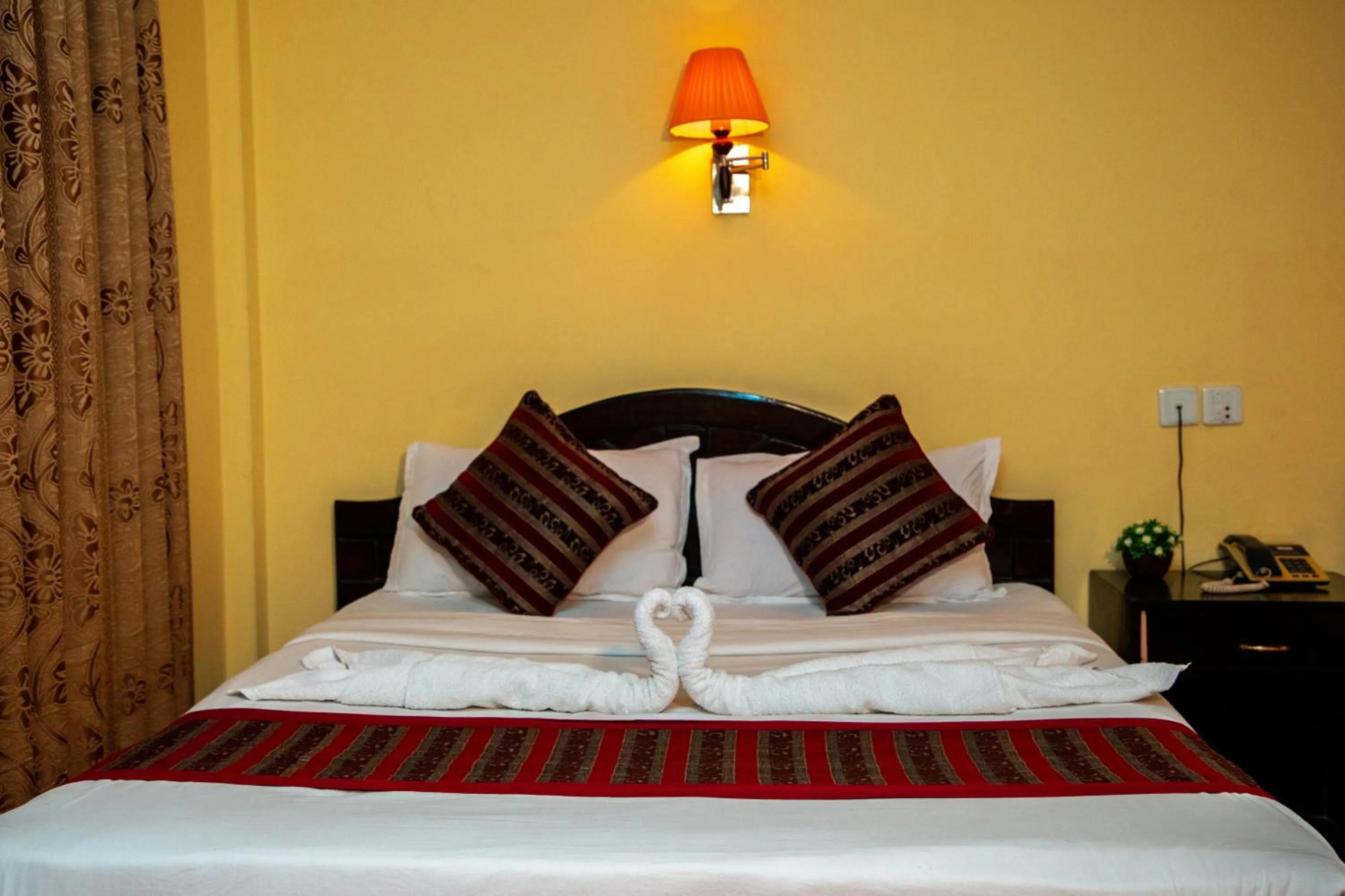 Bed in Hotel Bougainvillea