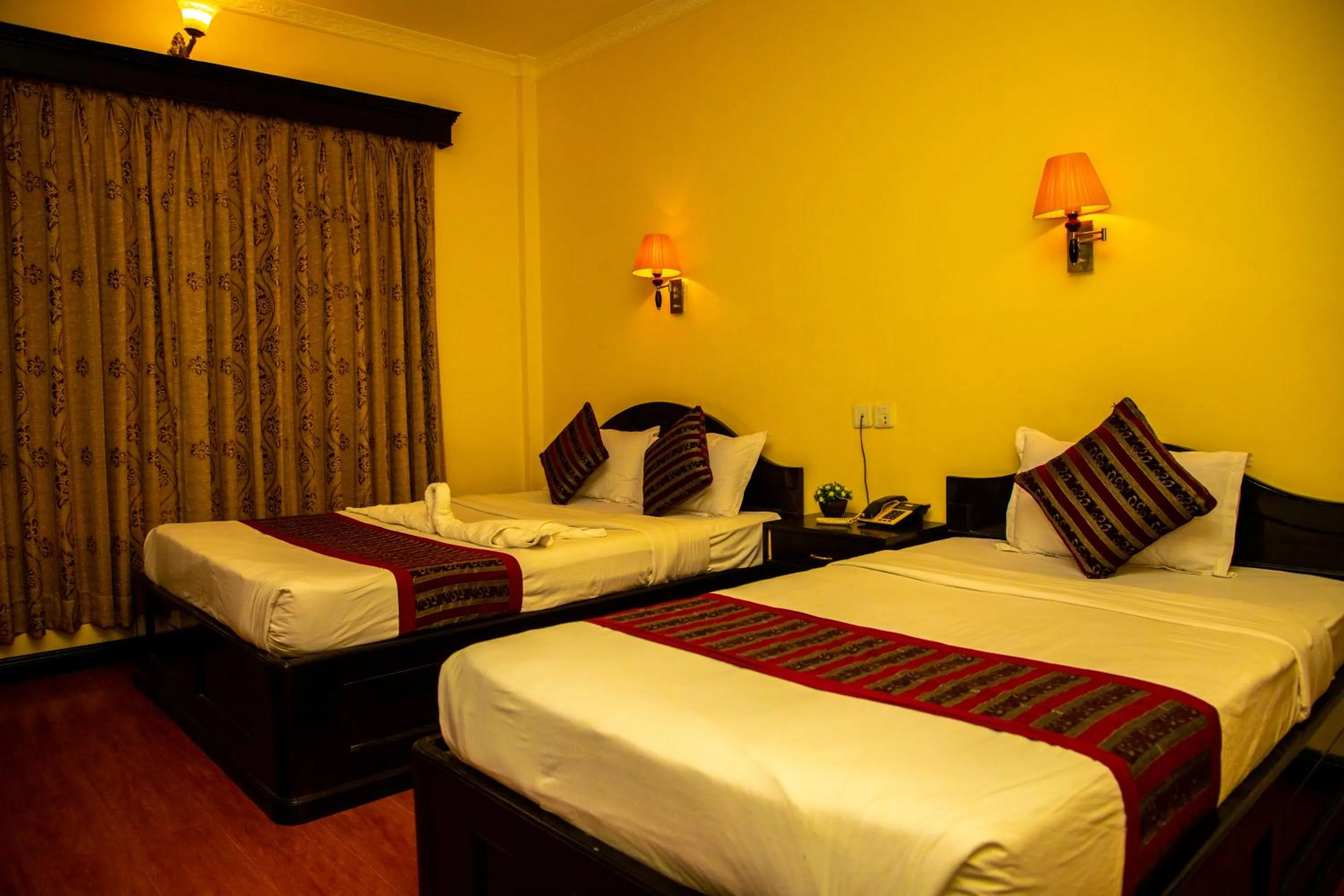 Bed in Hotel Bougainvillea