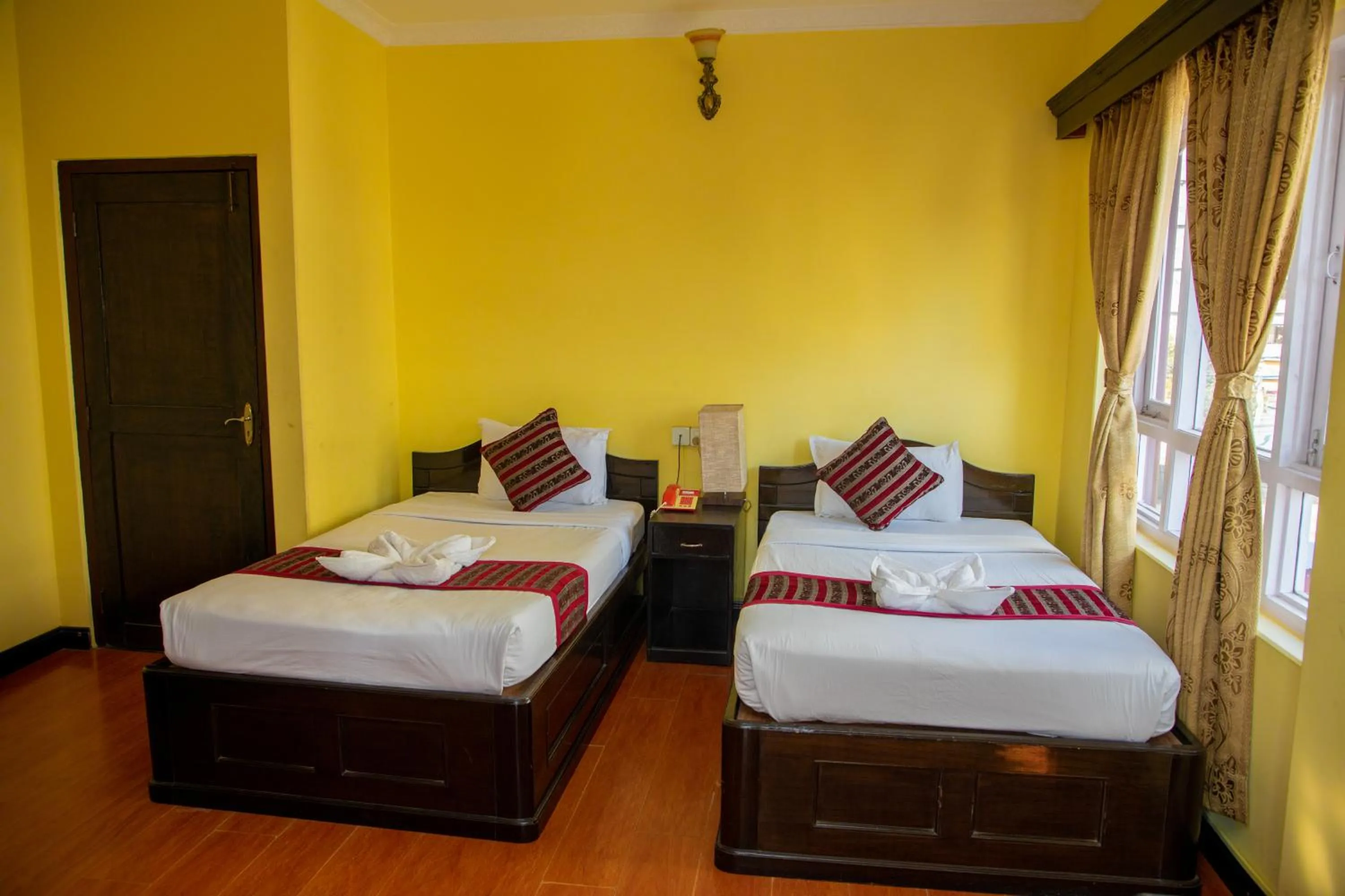 Bed in Hotel Bougainvillea