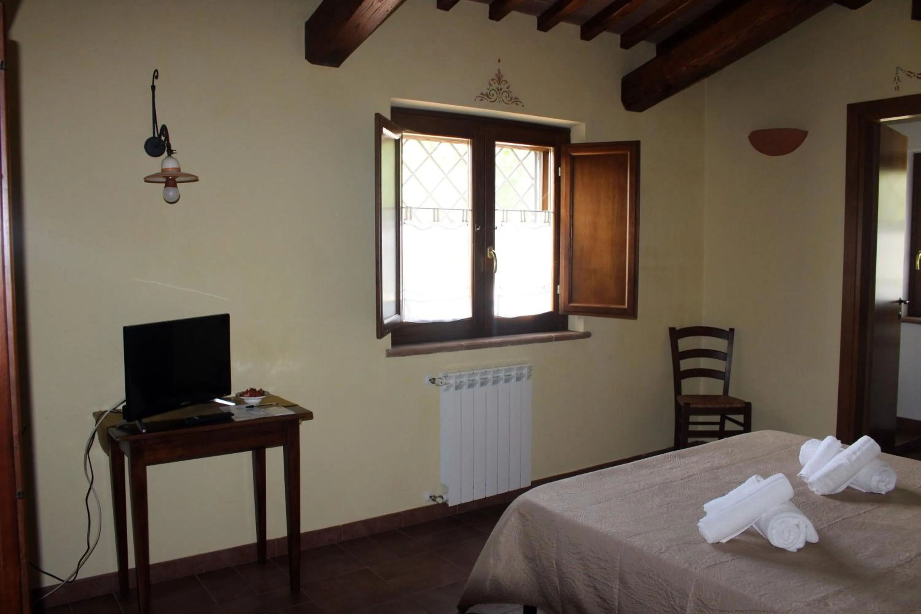Bed, TV/Entertainment Center in Il Podere San Giuseppe
