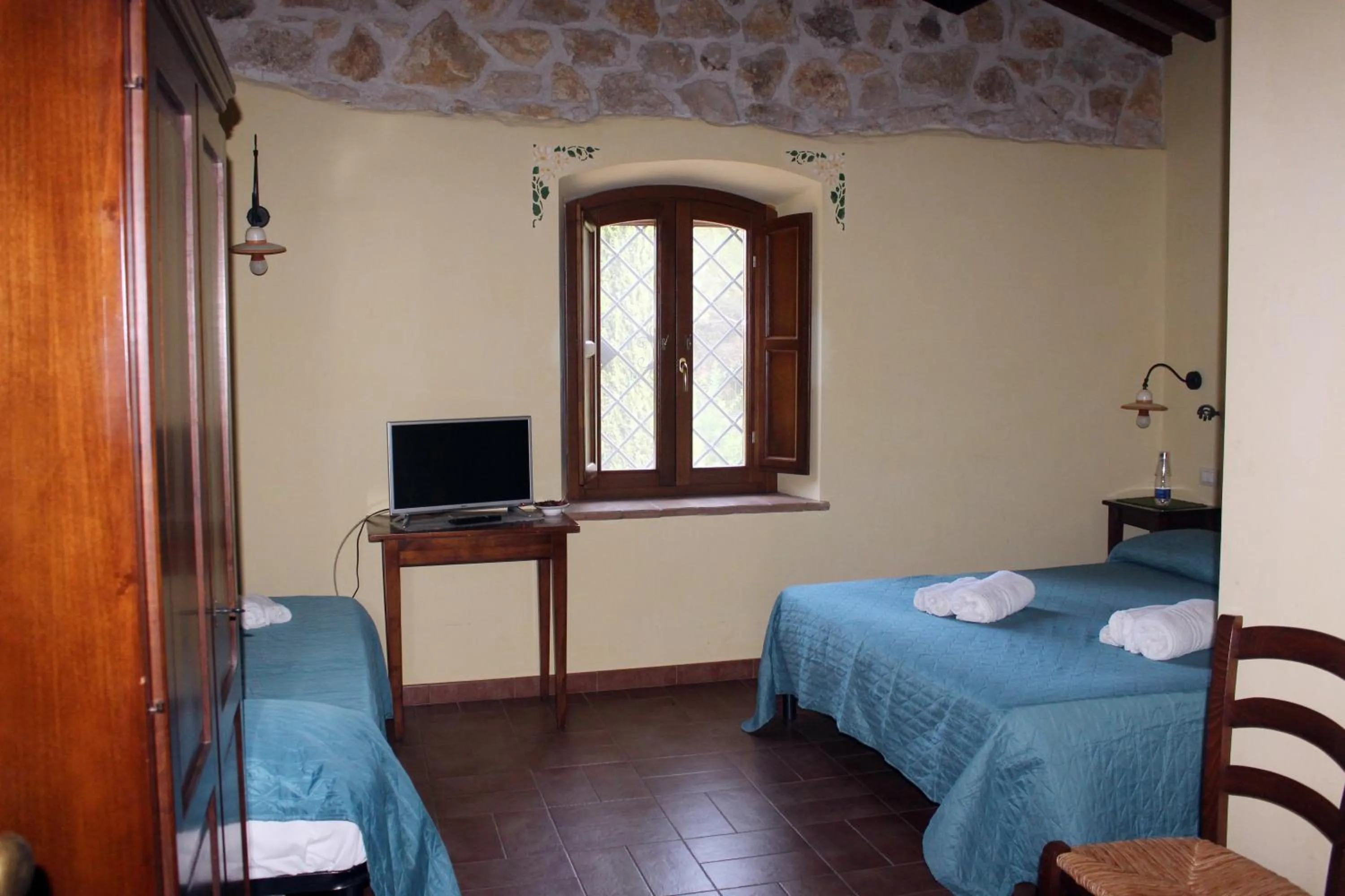 Bed, TV/Entertainment Center in Il Podere San Giuseppe