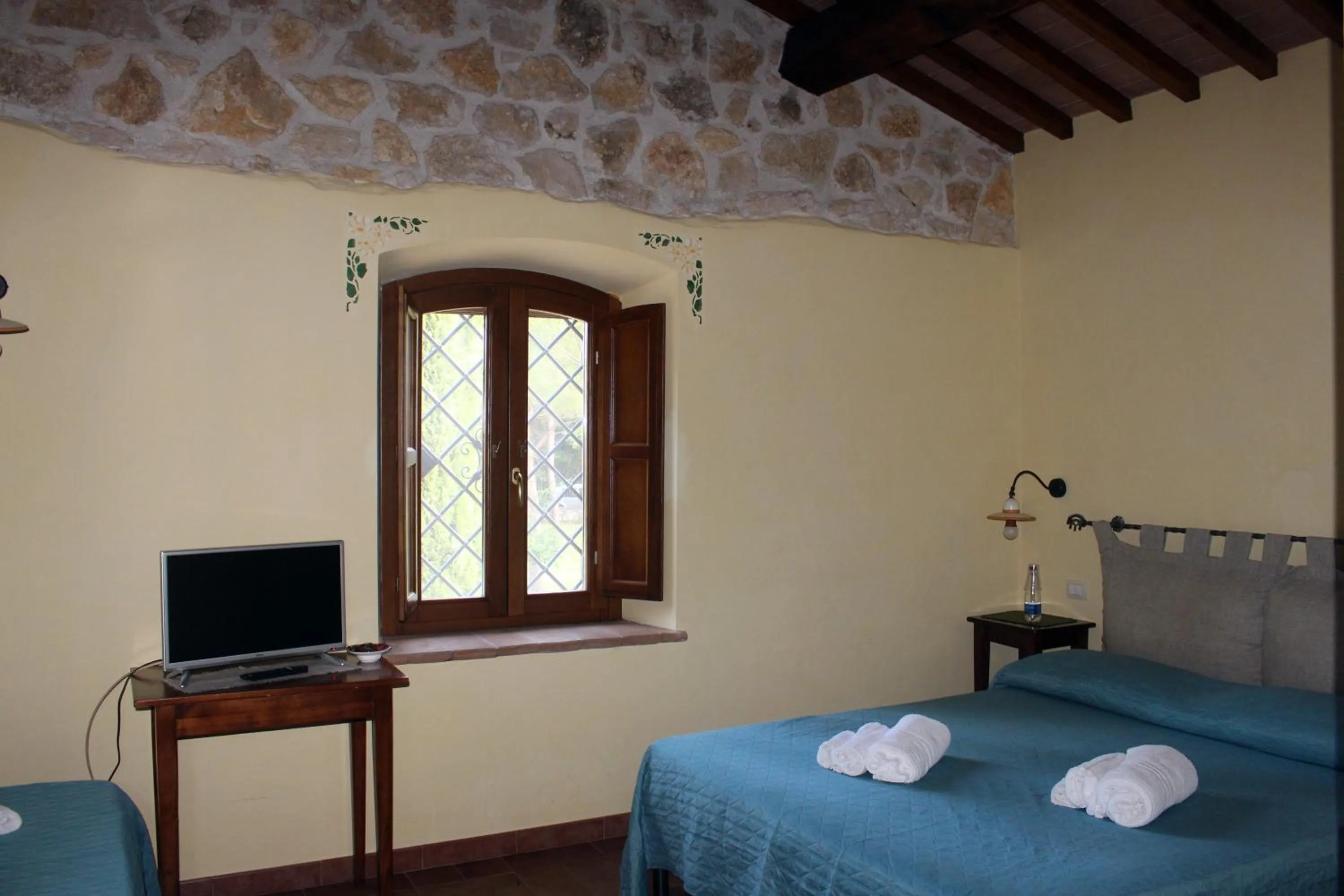 Bed, TV/Entertainment Center in Il Podere San Giuseppe