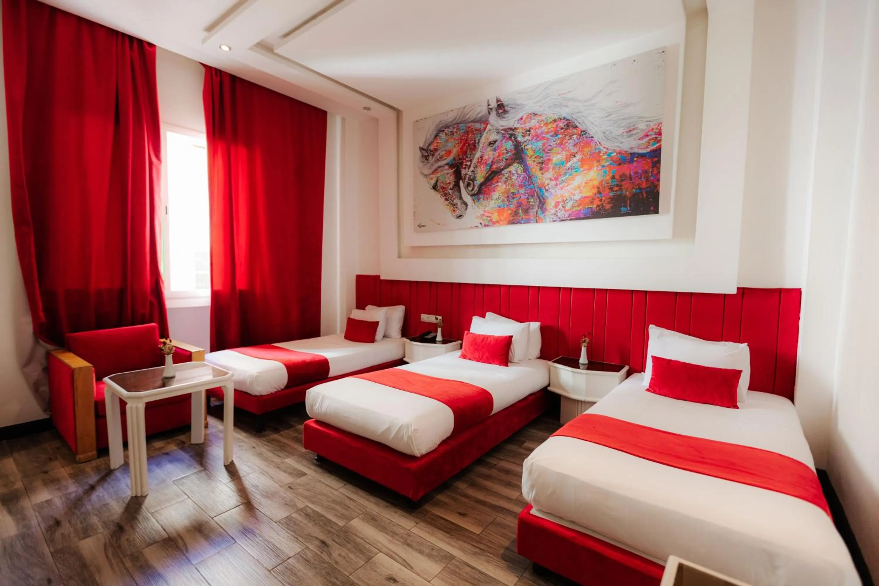 Bed in WINDSOR HOTEL CITY CENTER