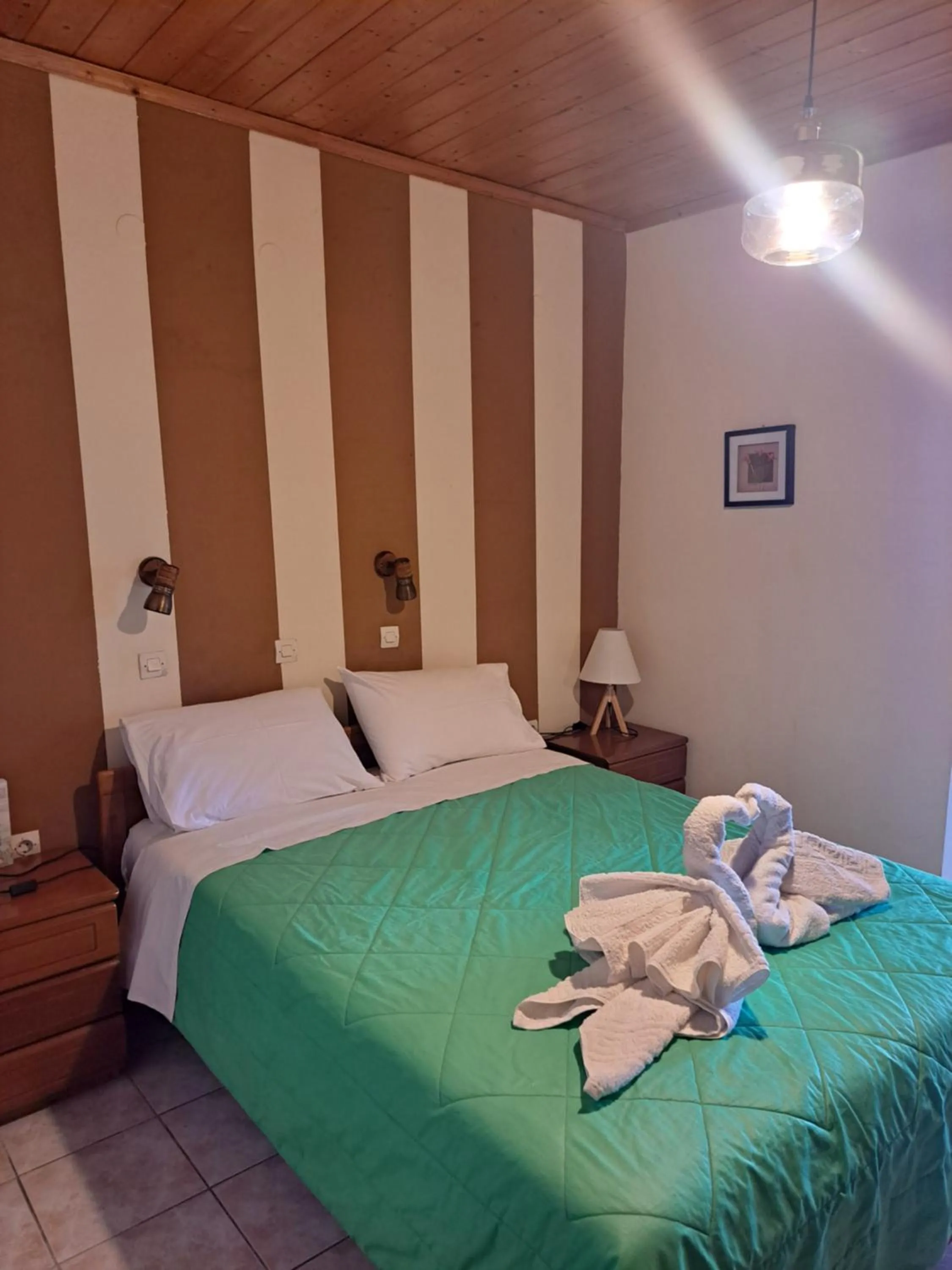 Bed in Marinos Studios at Lourdata village