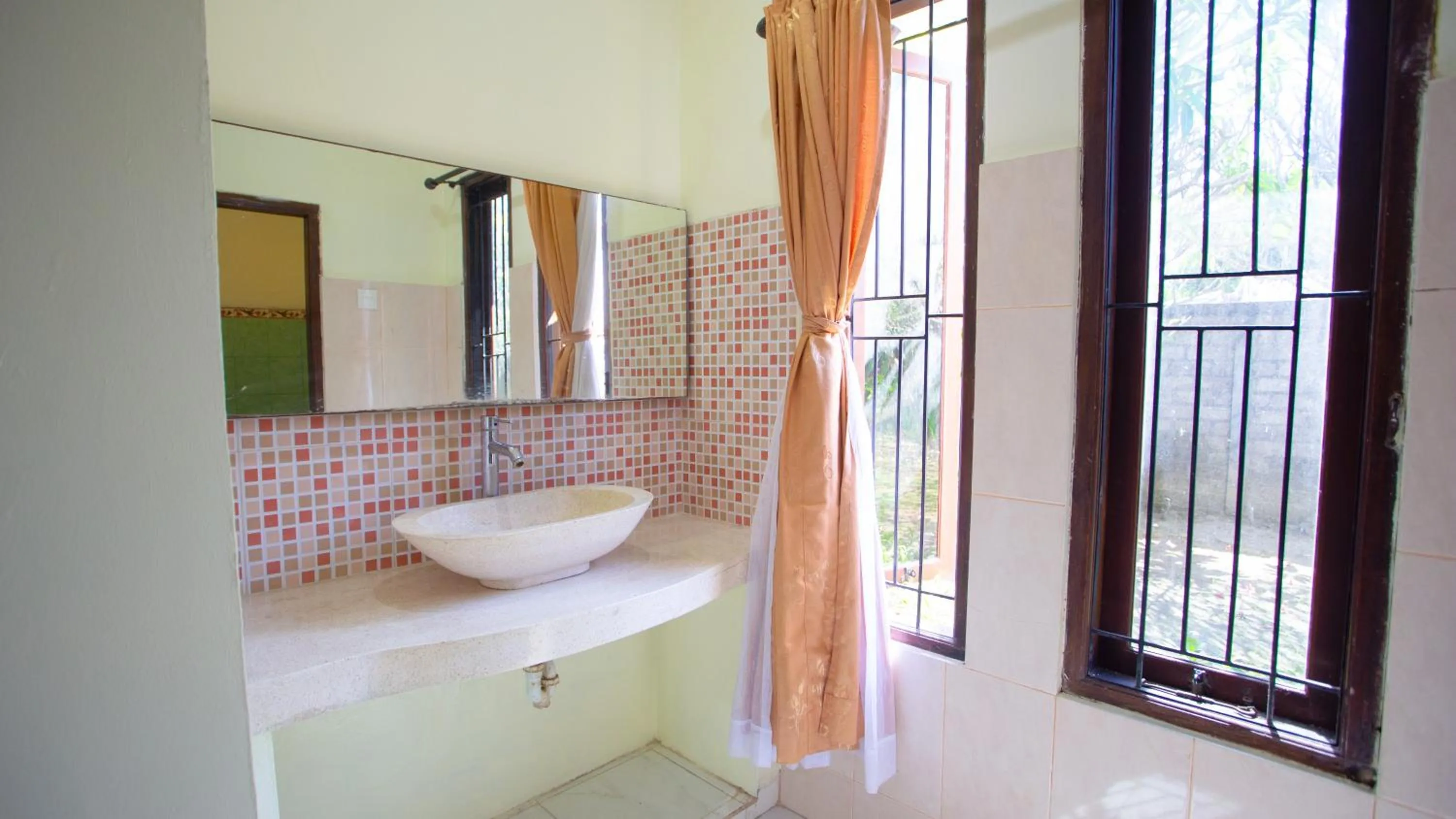Bathroom in Teges Inn Kuta