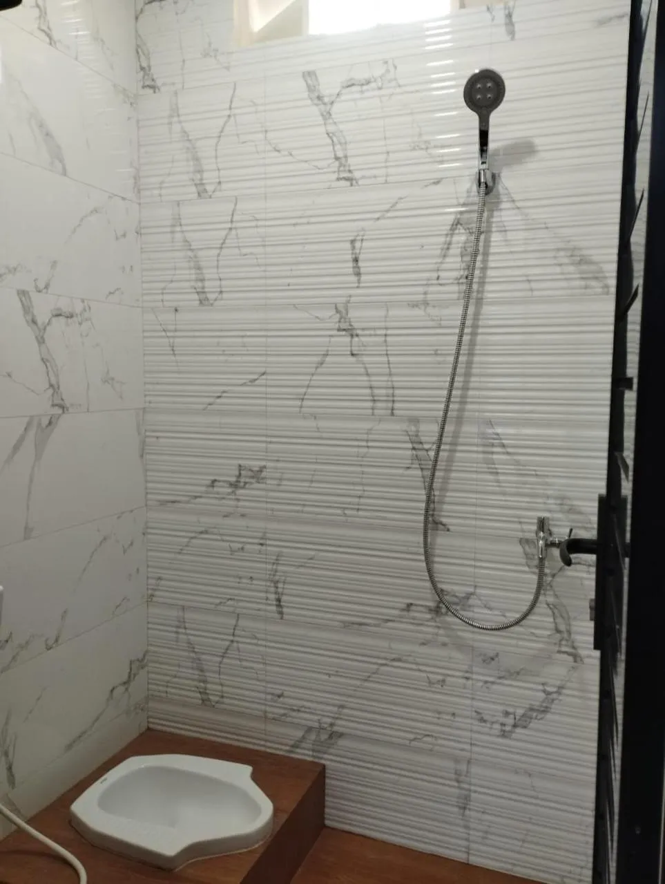 Bathroom in Musafir Guest House Syariah