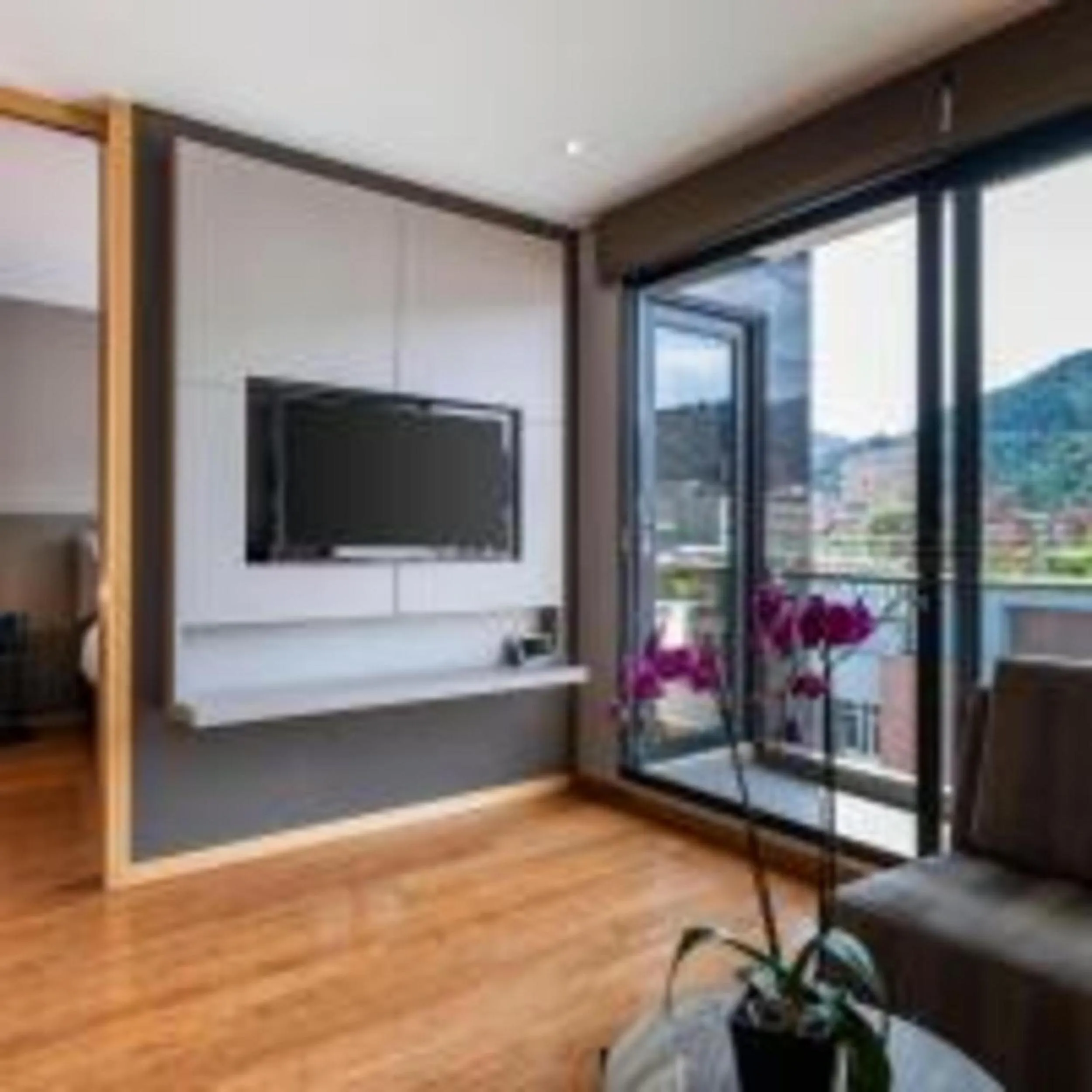 Communal lounge/ TV room in Hotel 93 Luxury Suites by Preferred