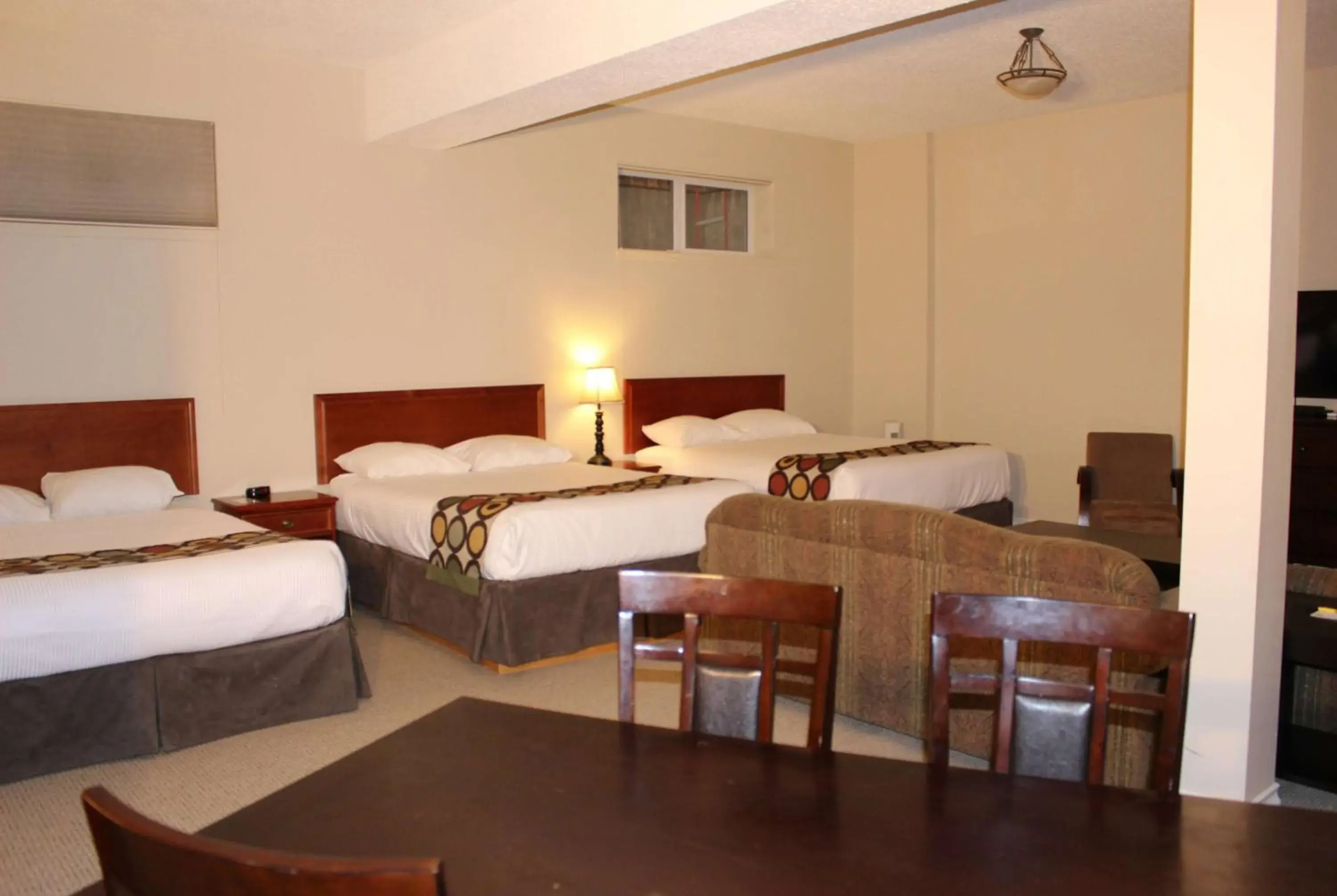 Queen Room with Three Queen Beds - Basement/Non-Smoking in Super 8 by Wyndham Cochrane Queen Room with Three Queen Beds - Basement/Non-Smoking in Super 8 by Wyndham Cochrane