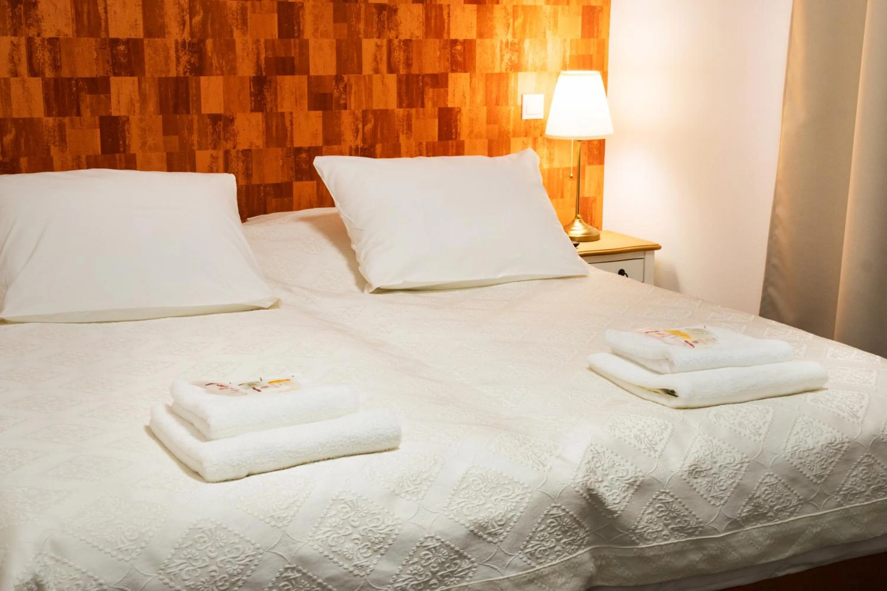 Bed in VILLA CENTRUM APARTMÁNY s RAŇAJKAMI A SAUNOU