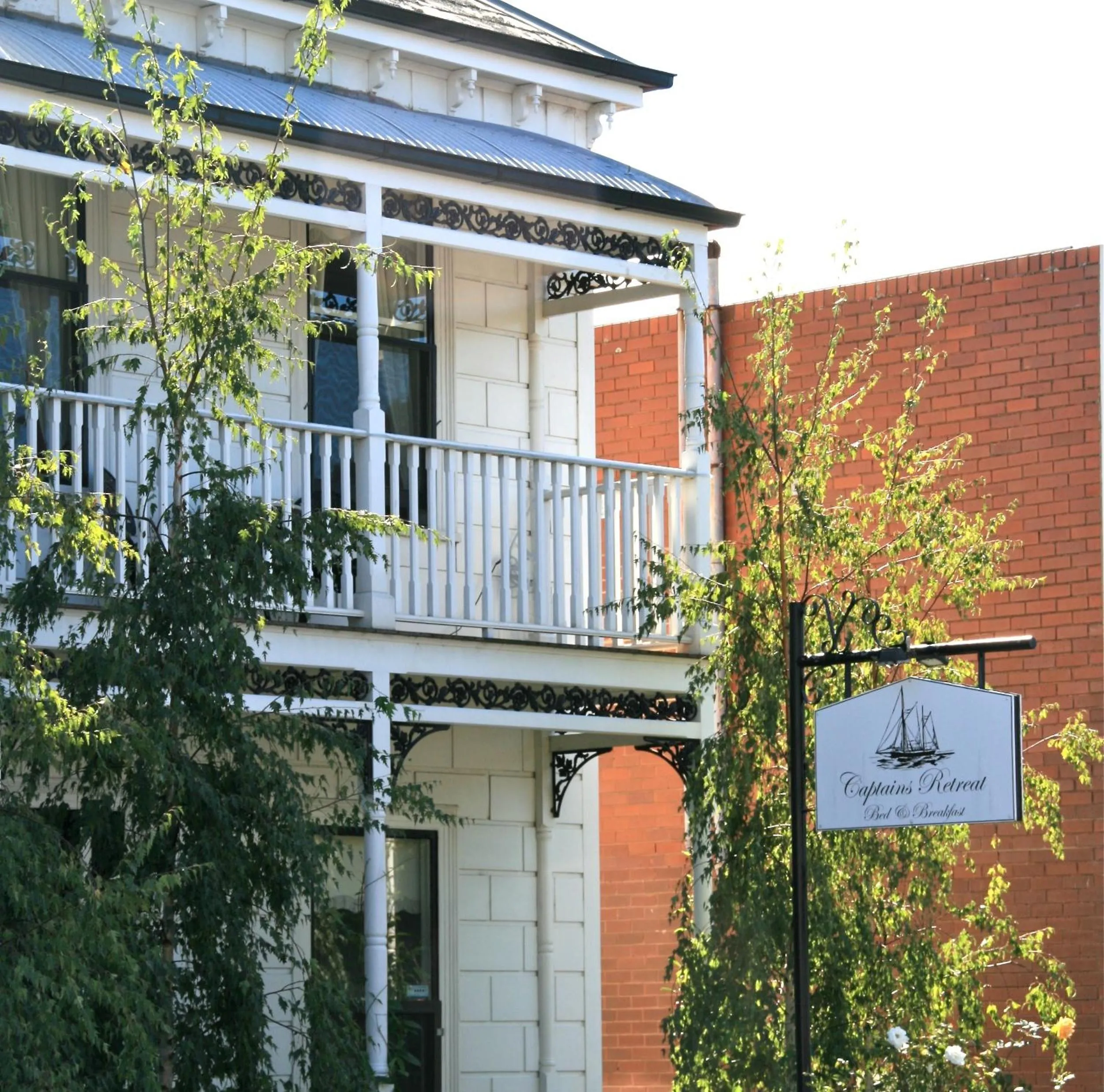 Property logo or sign in Captains Retreat Apartments and Cottages