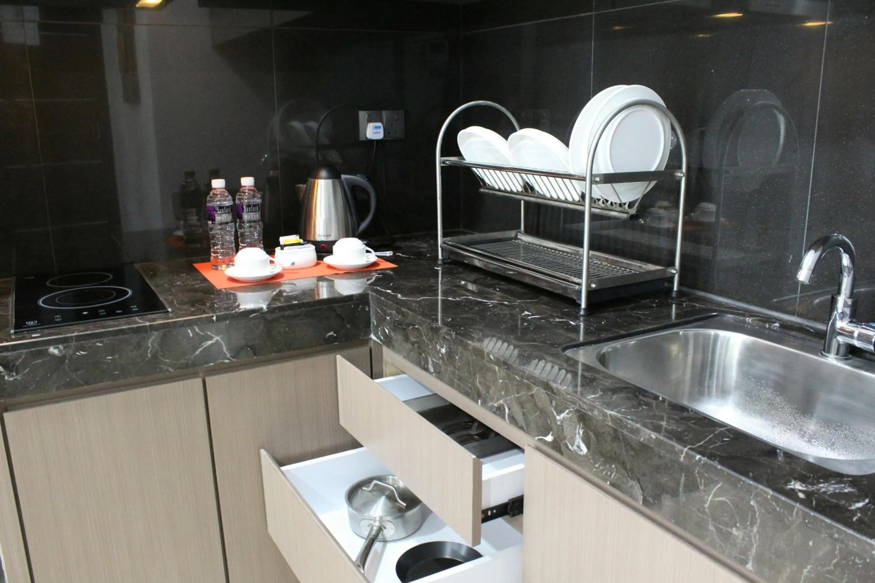 Kitchen or kitchenette in The Centro Hotel & Residence By Orchardz