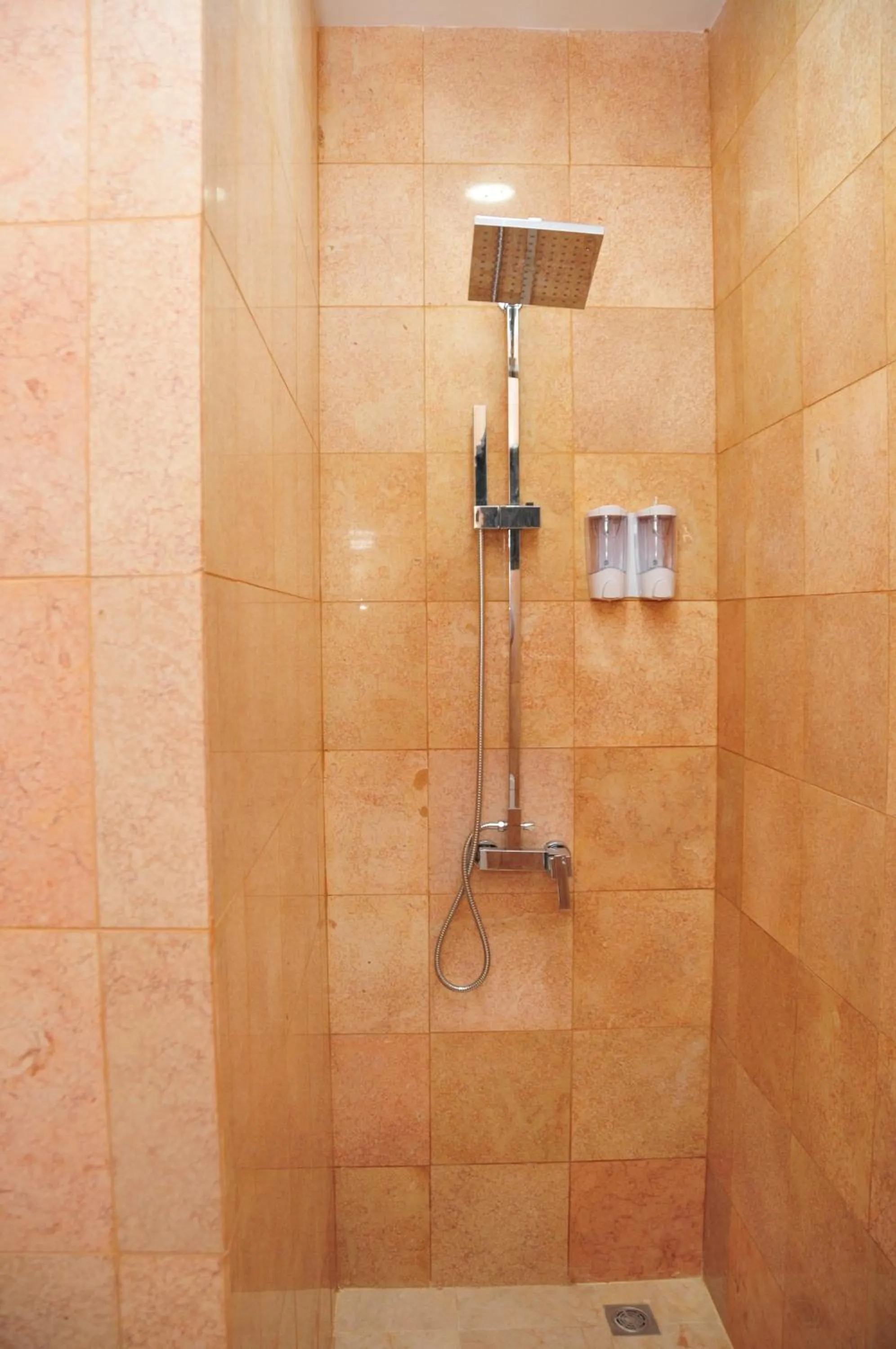 Shower in The Centro Hotel & Residence By Orchardz