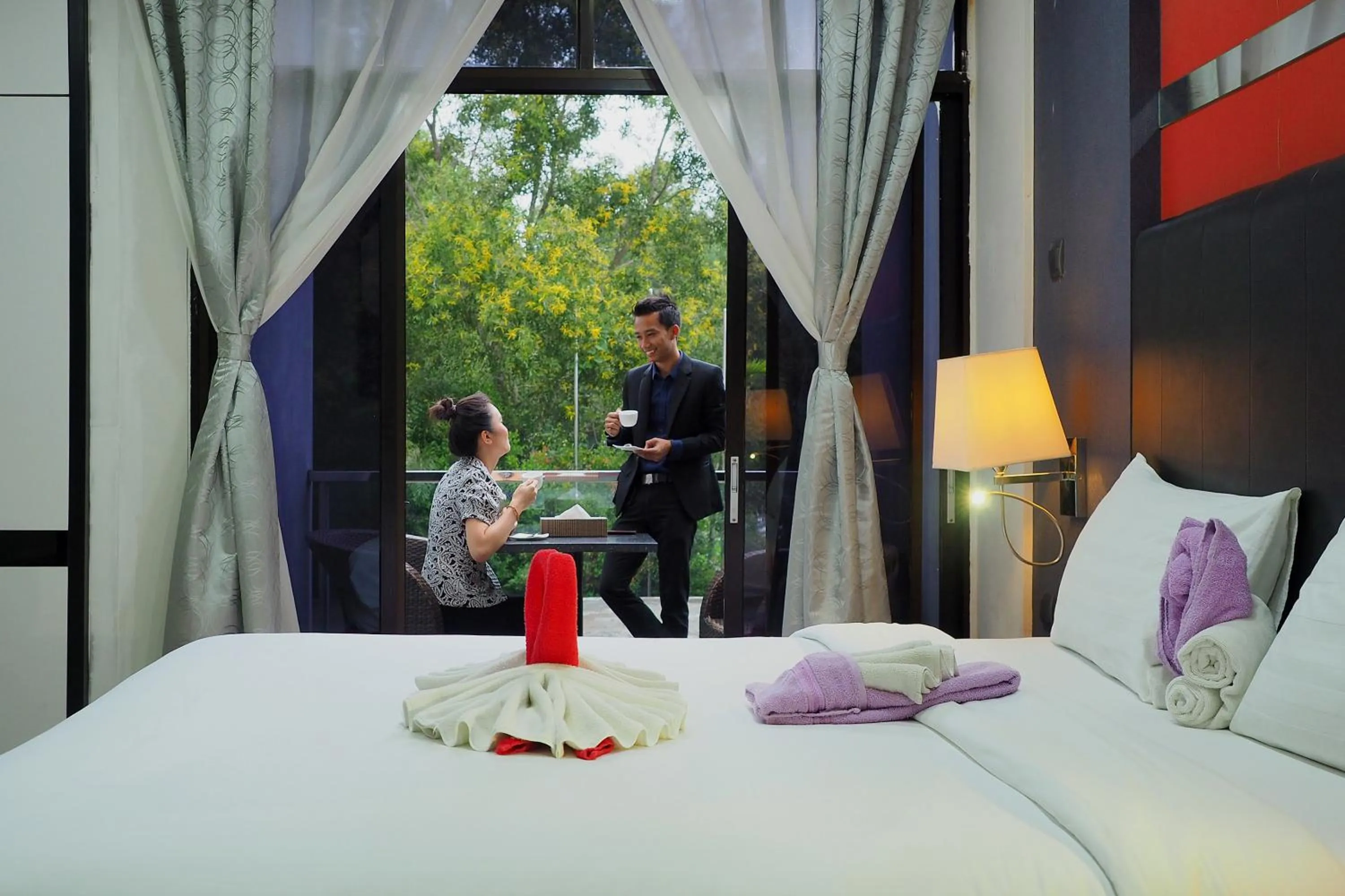 Bed in The Centro Hotel & Residence By Orchardz