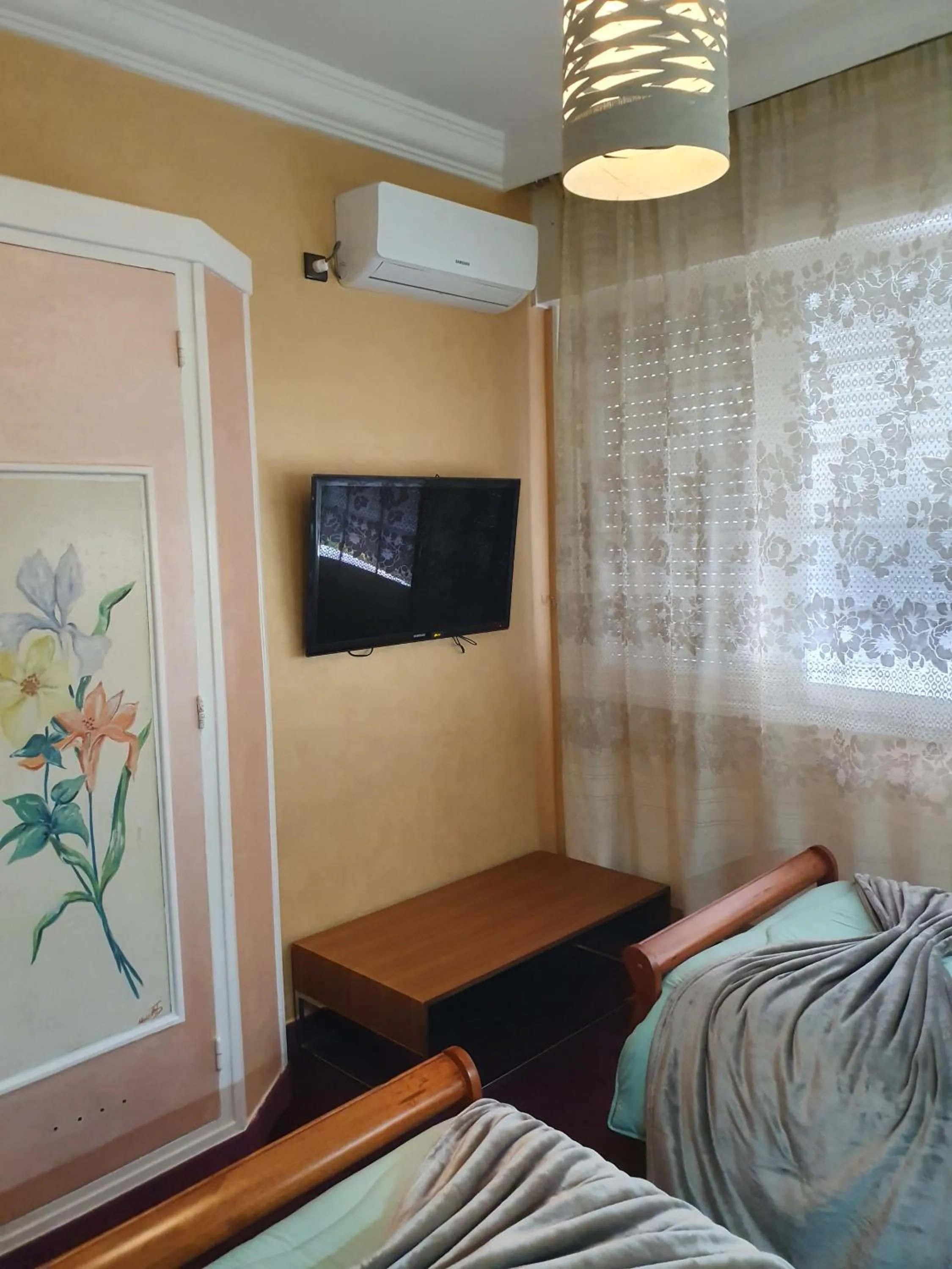 Bed in Ambassy Hotel