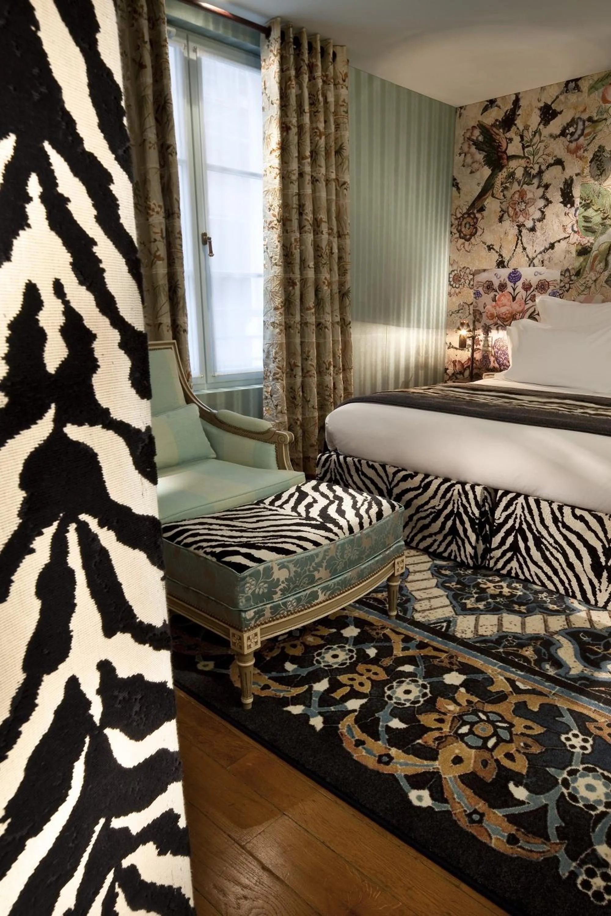 Seating area, Bed in Hôtel du Petit Moulin, Haute Couture hotel by Lacroix