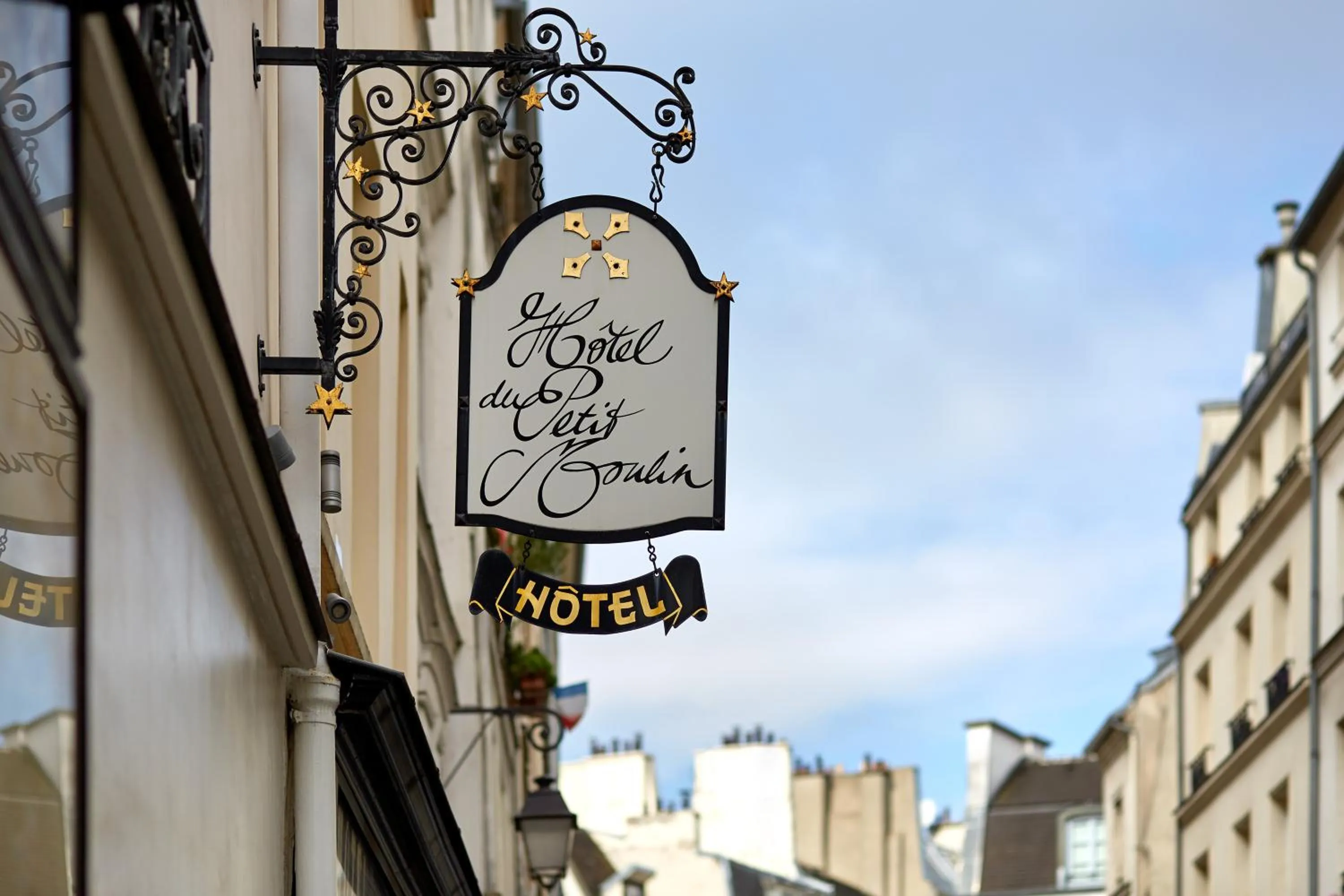 Property logo or sign in Hôtel du Petit Moulin, Haute Couture hotel by Lacroix