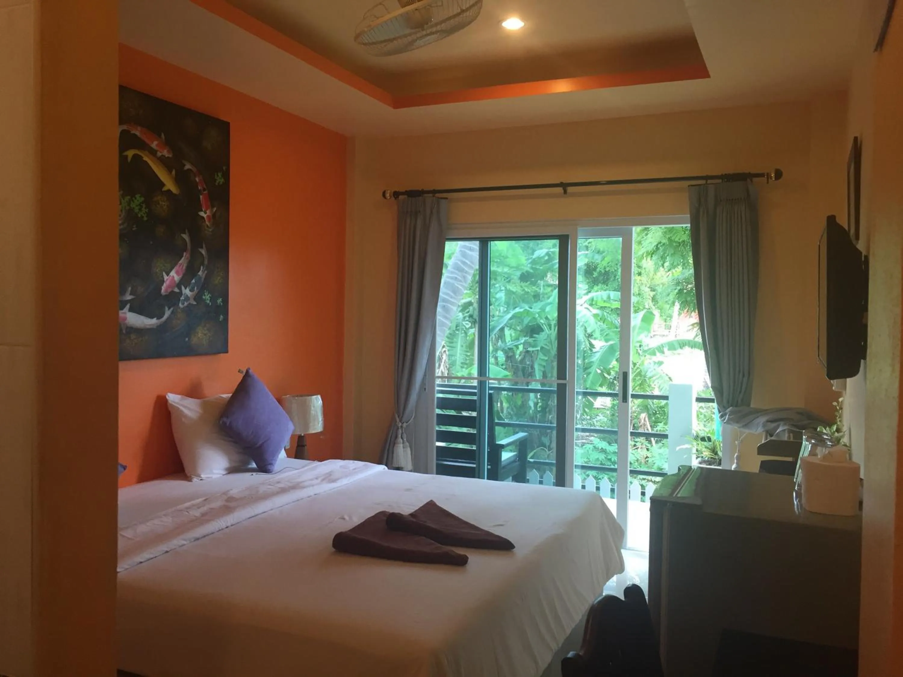 Bed in Baan Suan Ta Hotel