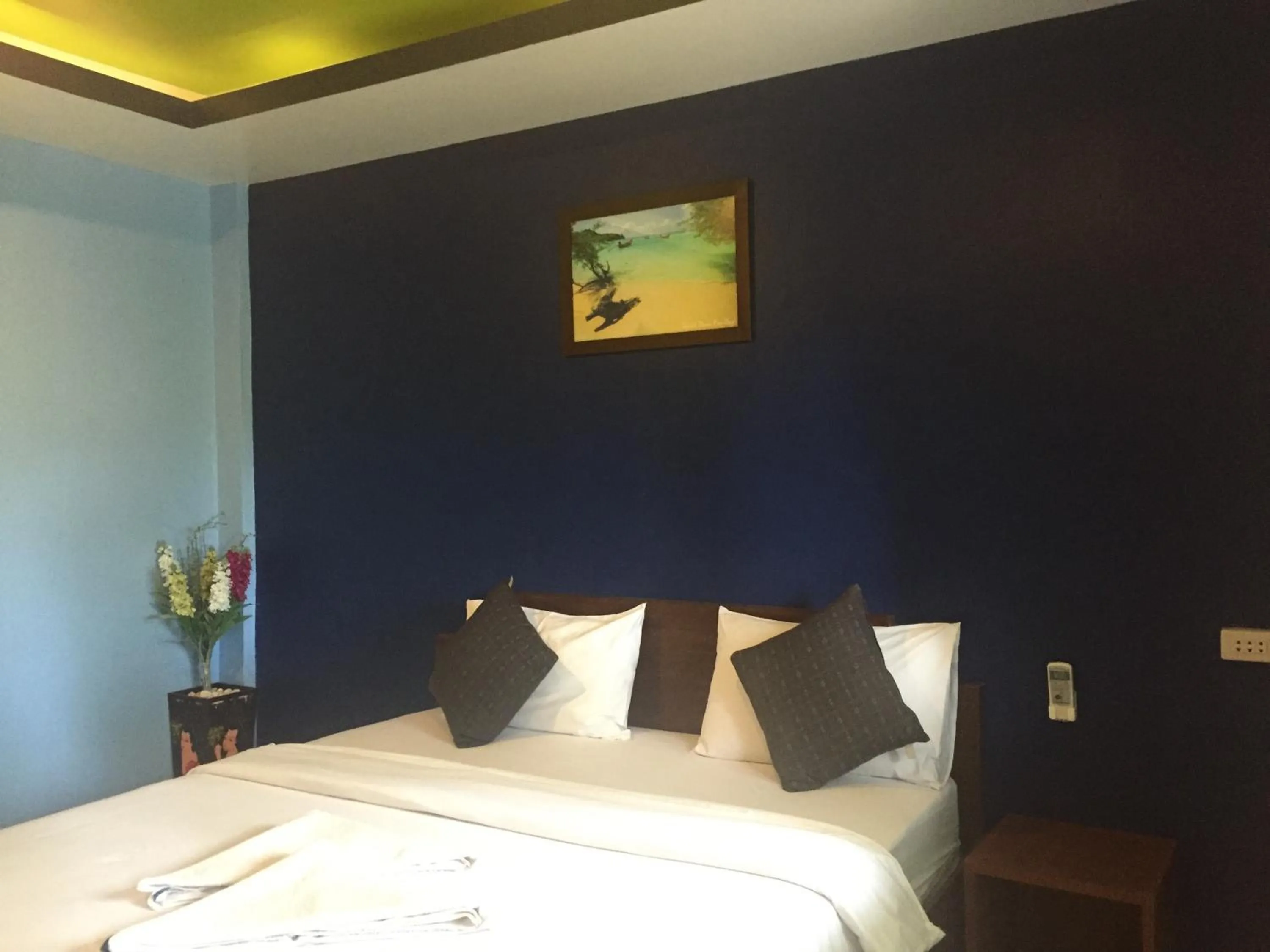 Bed in Baan Suan Ta Hotel