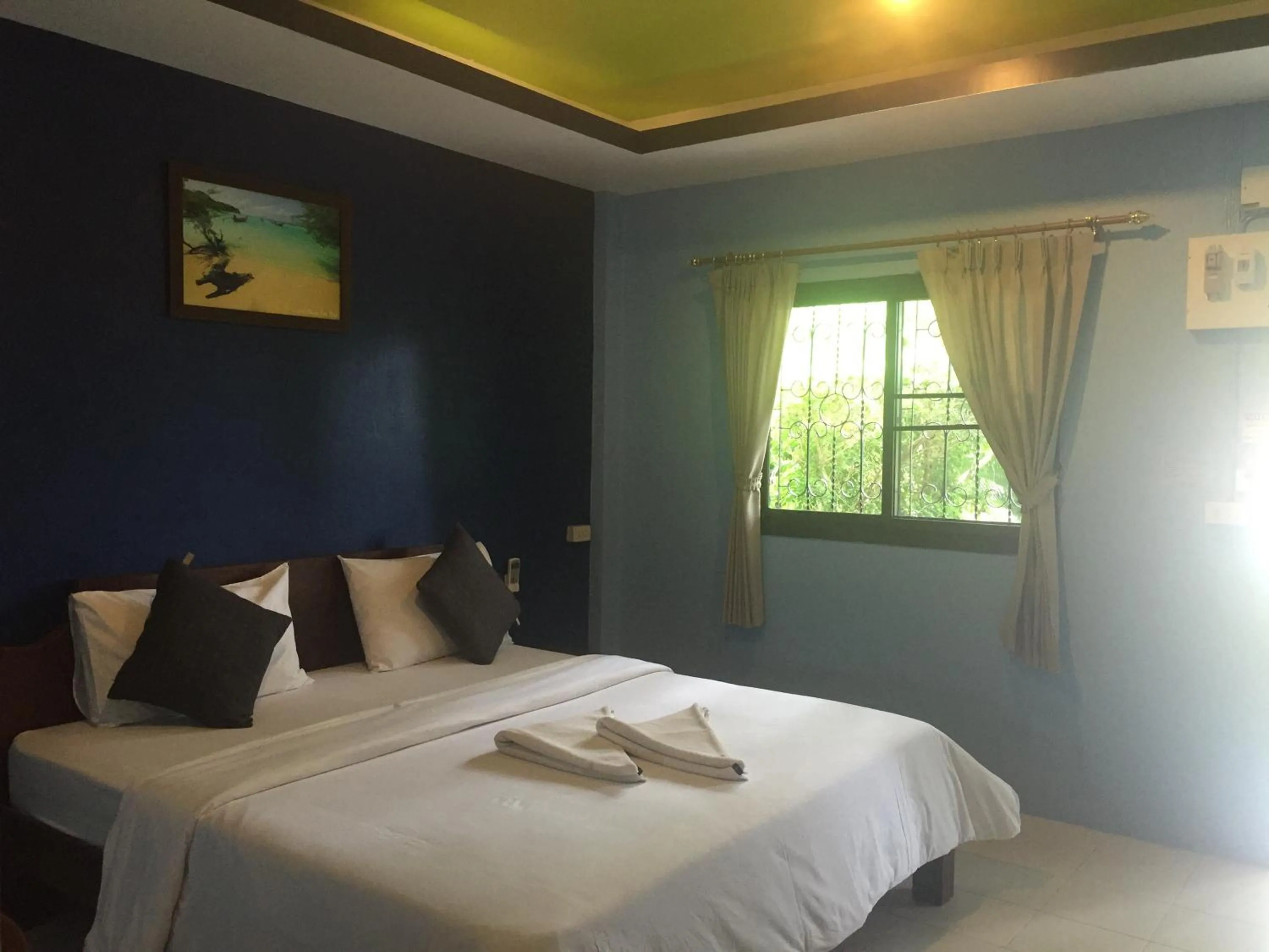 Bed in Baan Suan Ta Hotel