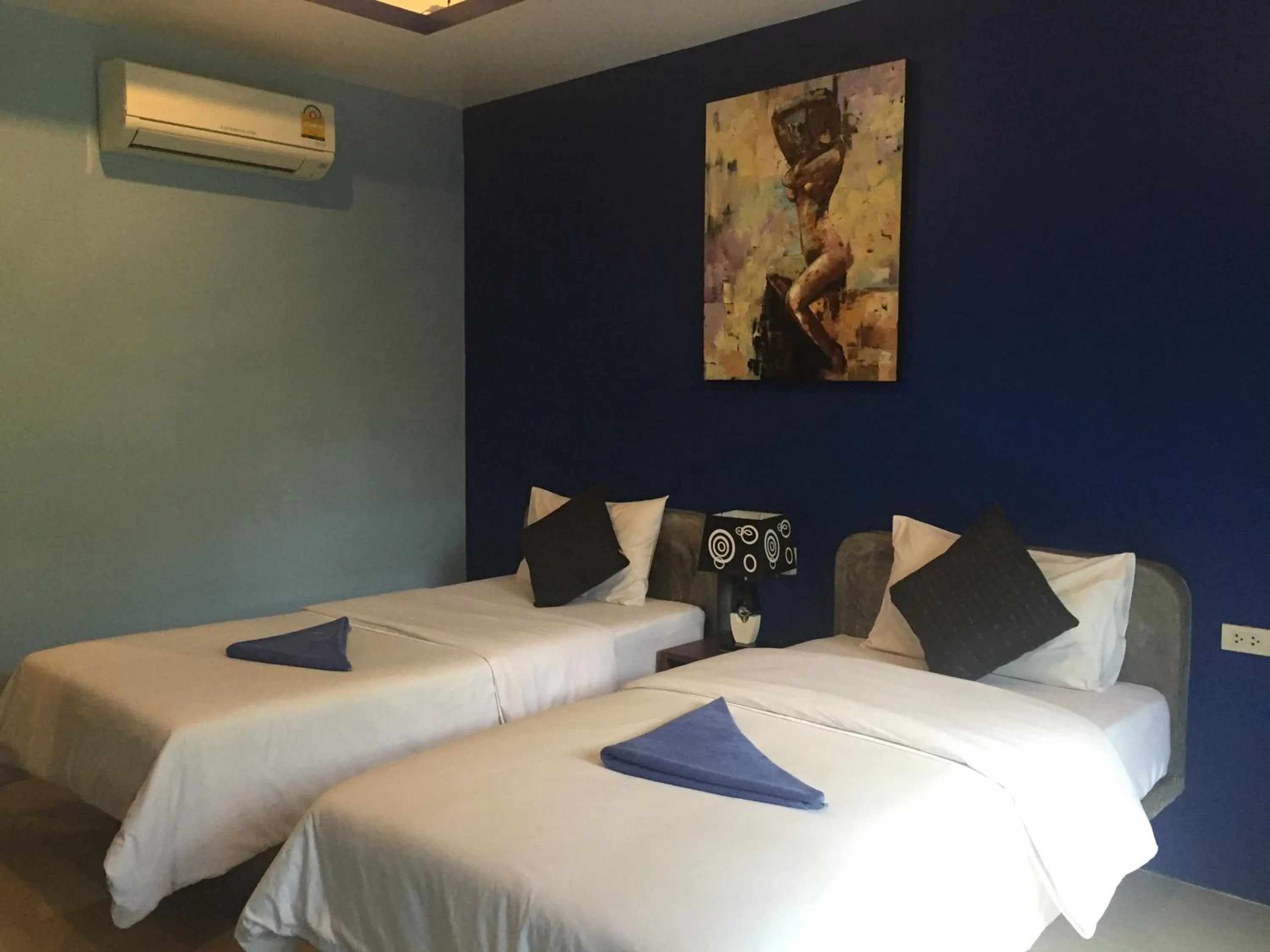 Bed in Baan Suan Ta Hotel