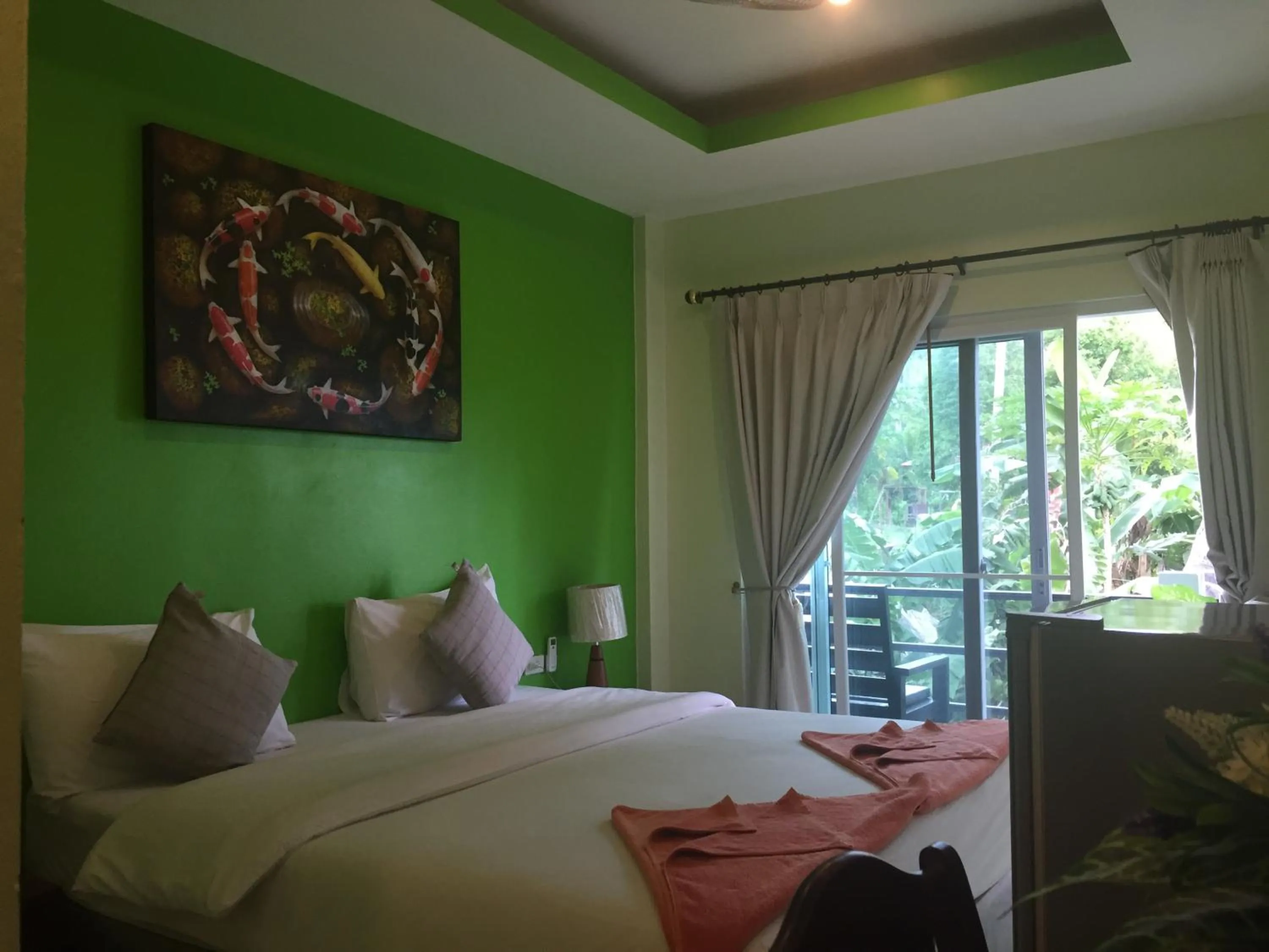 Bed in Baan Suan Ta Hotel