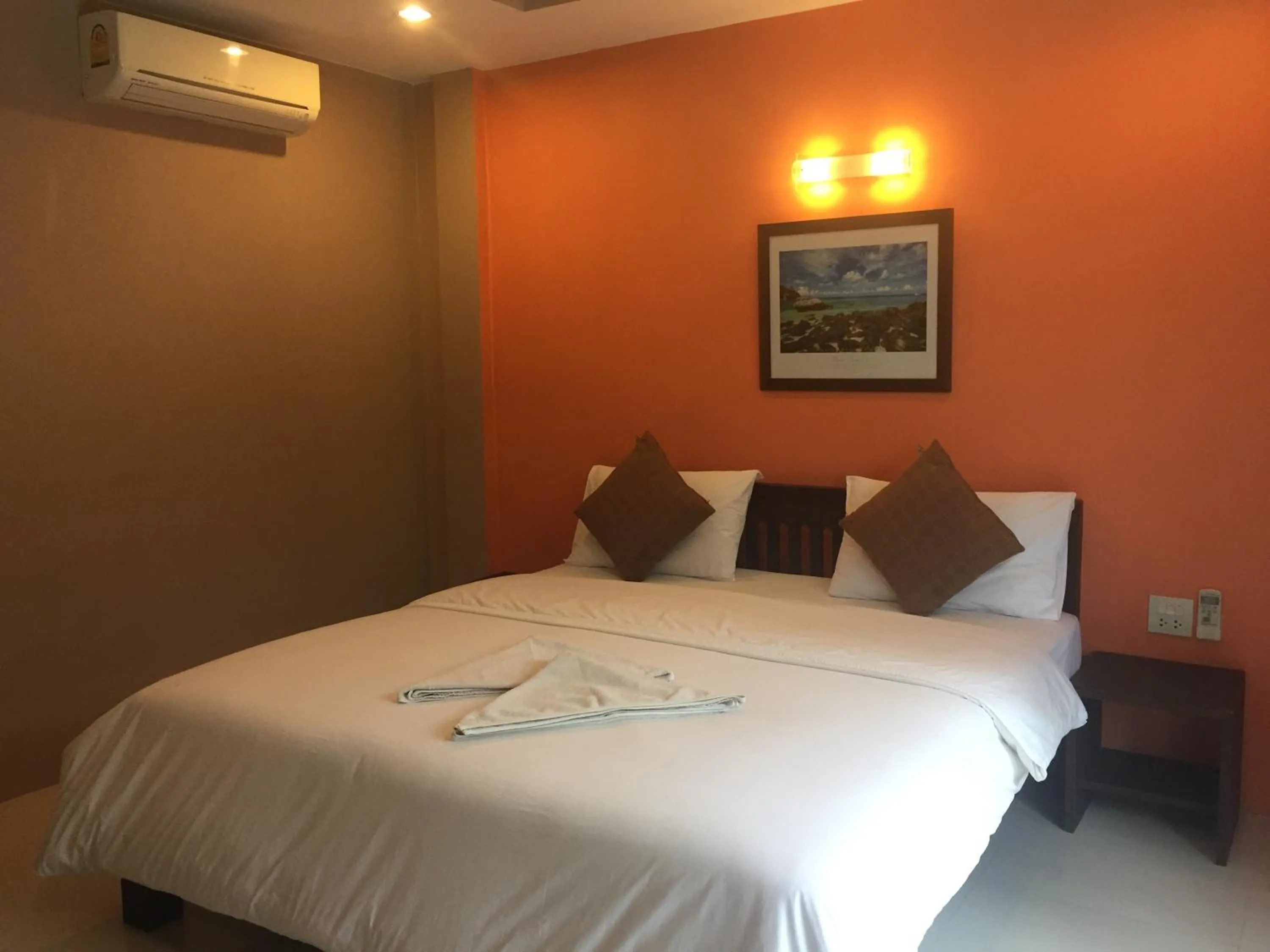 Bed in Baan Suan Ta Hotel