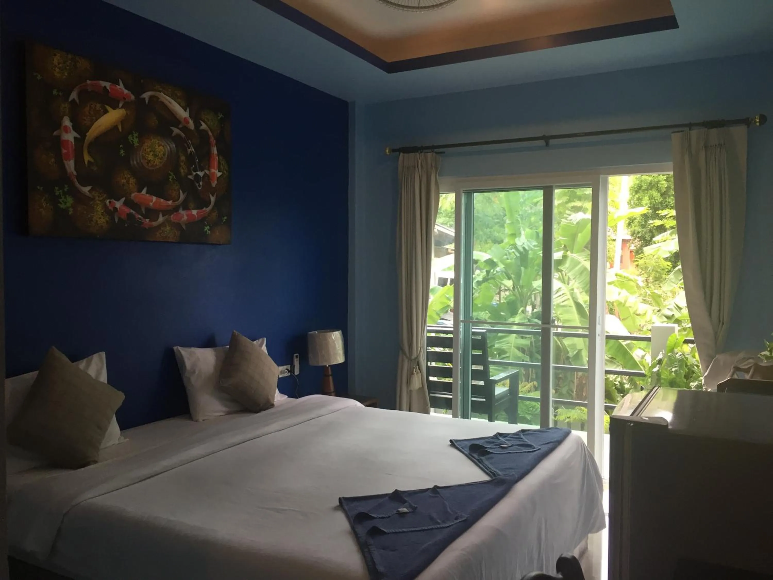 Bed in Baan Suan Ta Hotel