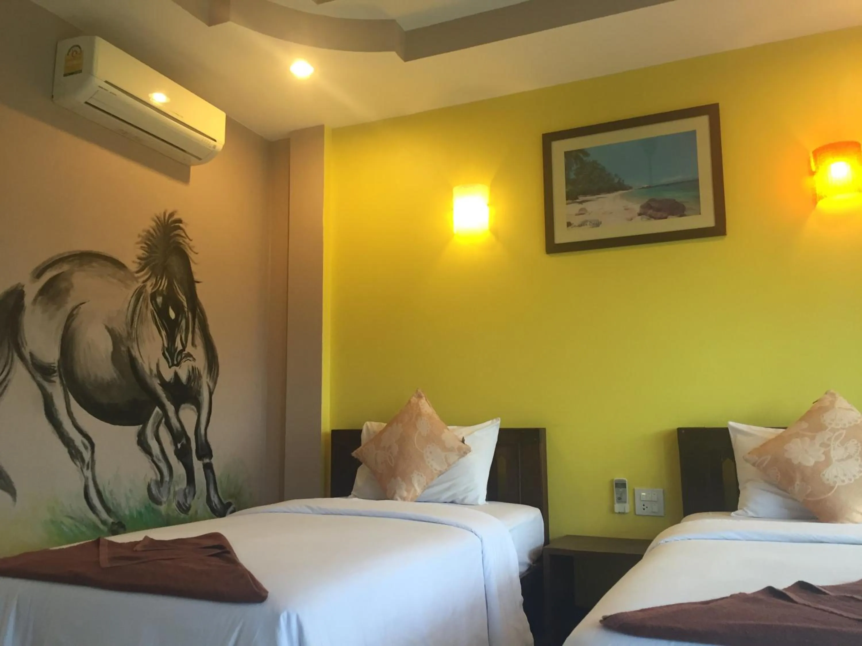 Bed in Baan Suan Ta Hotel