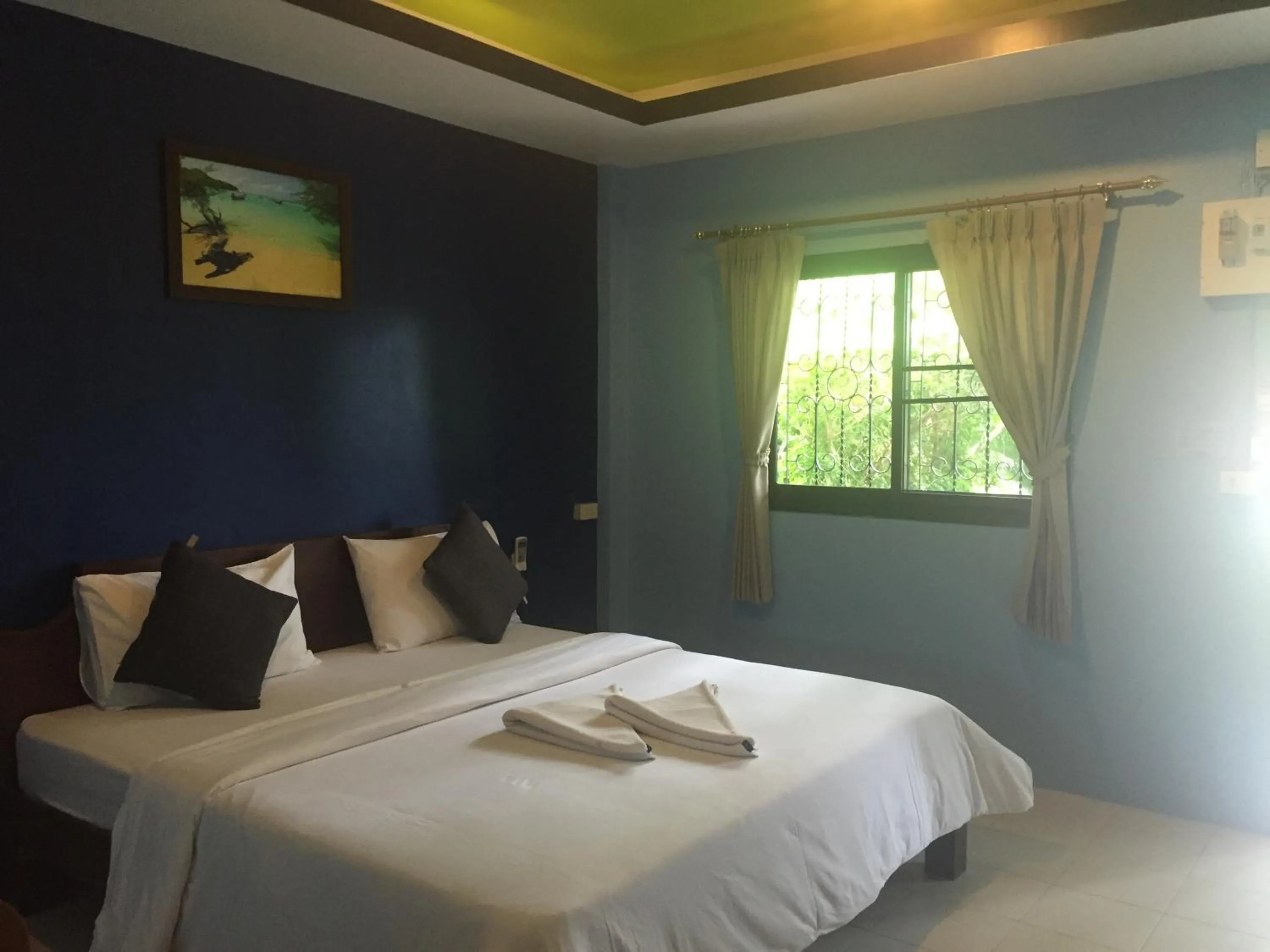 Bed in Baan Suan Ta Hotel