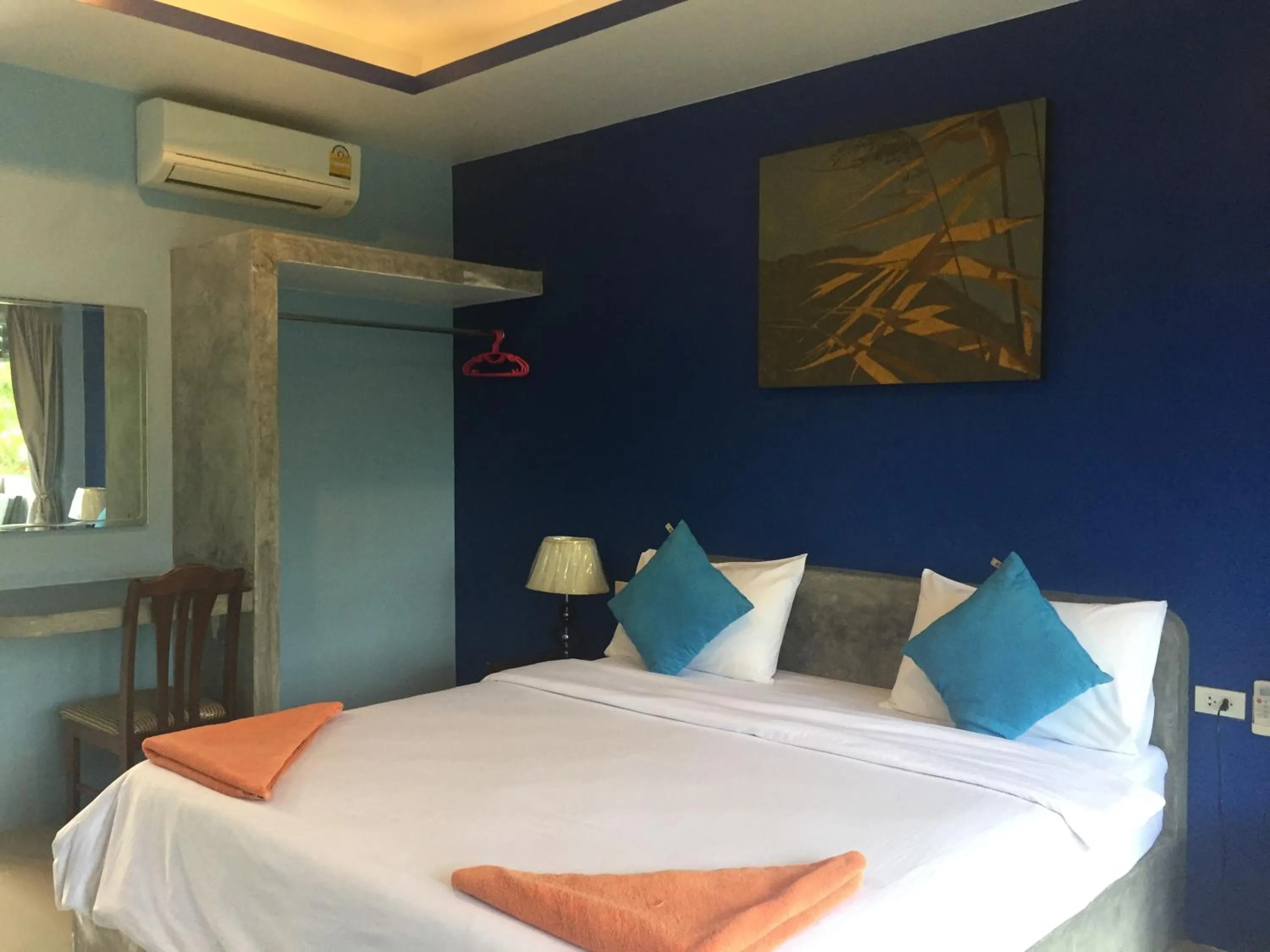 Bed in Baan Suan Ta Hotel