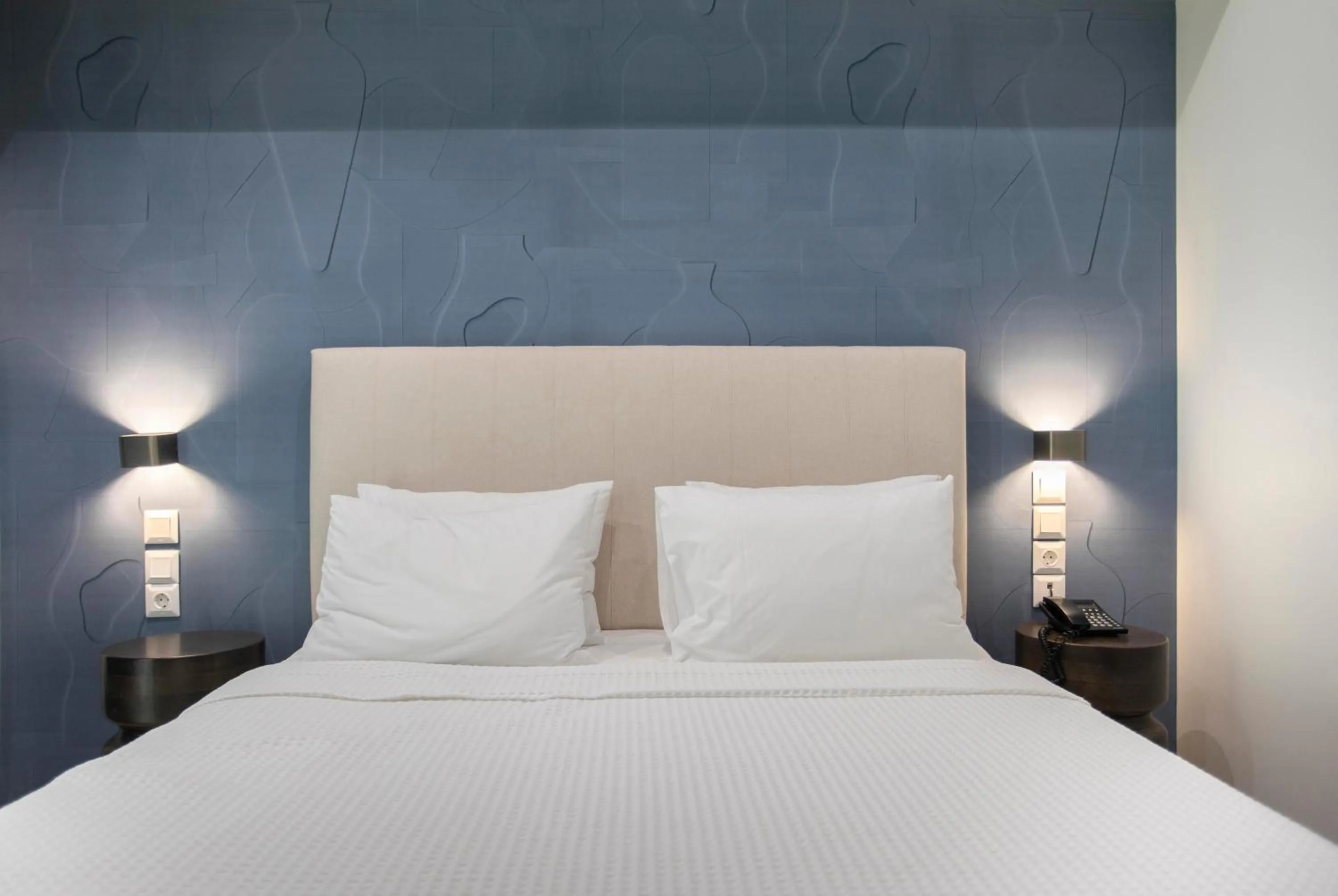 Bed in Phidias Piraeus Hotel