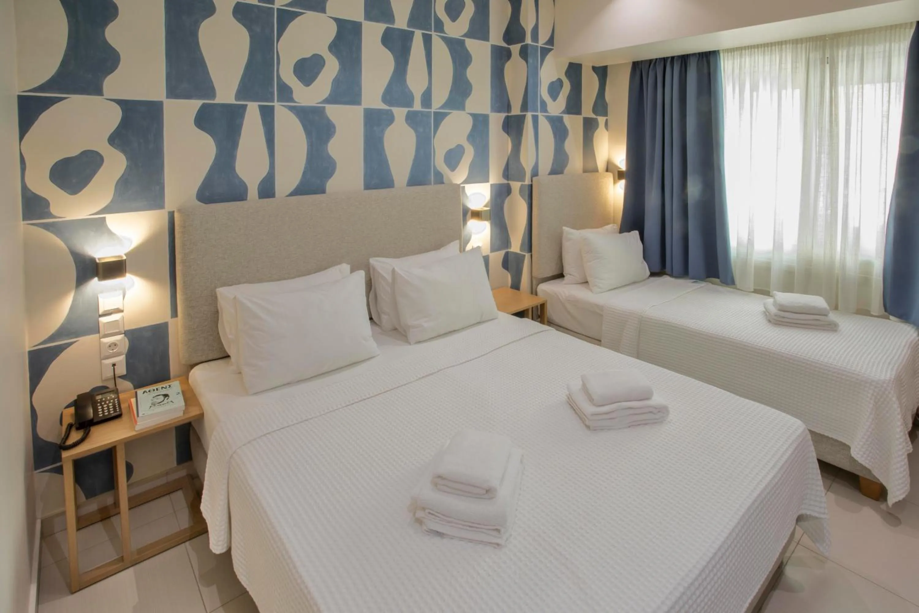 Bed in Phidias Piraeus Hotel