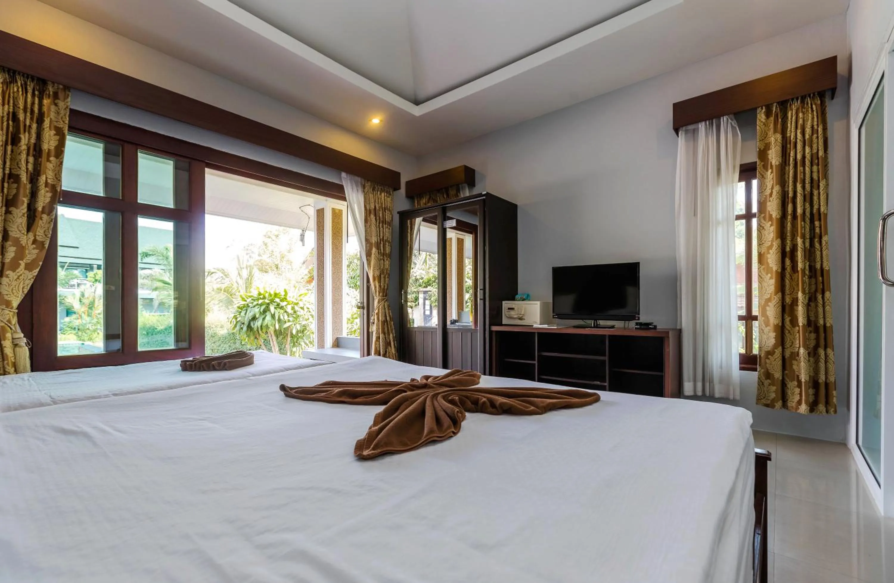 Bed in Oscar Villa Aonang Krabi