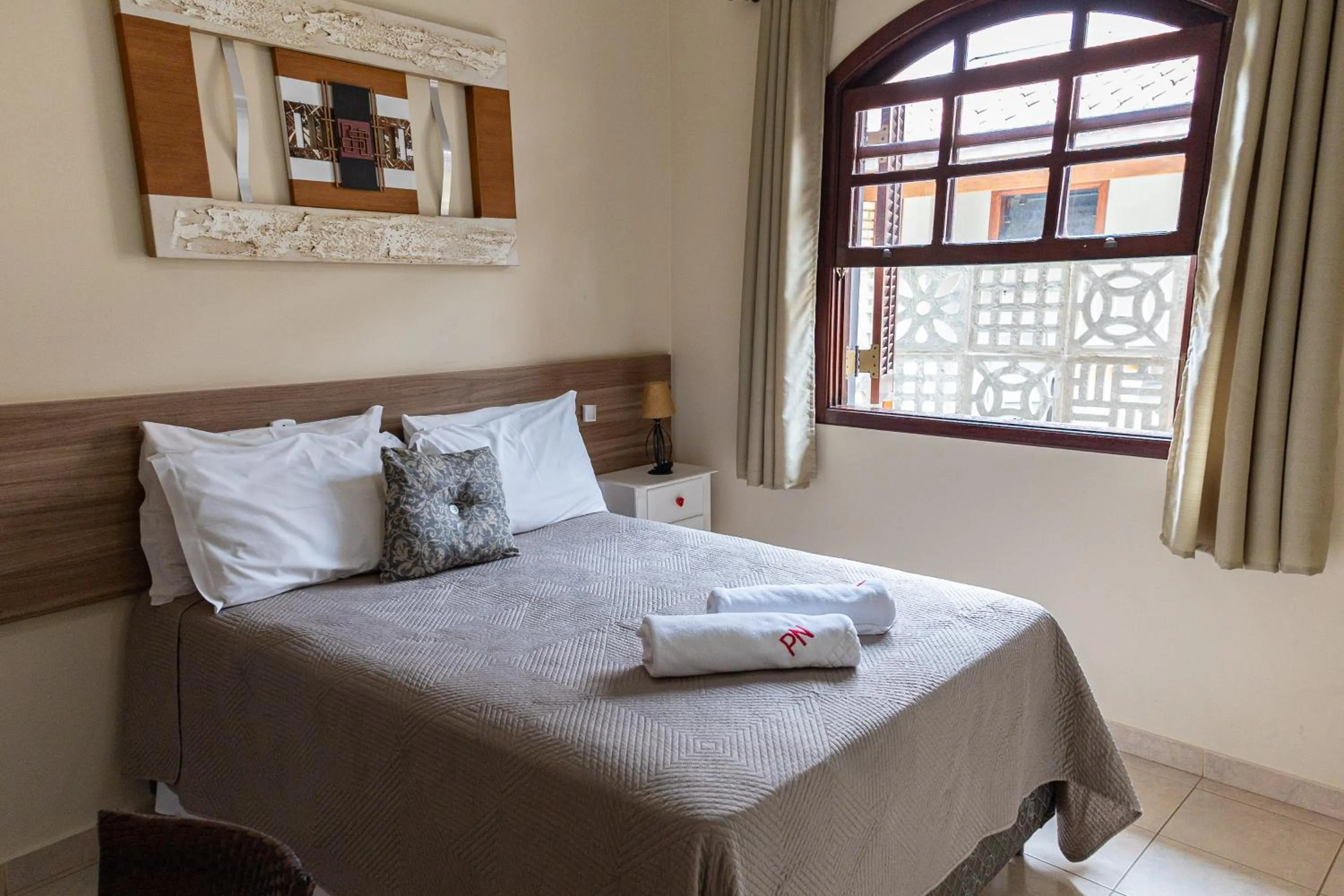 Bed in Pousada Nefelibatas