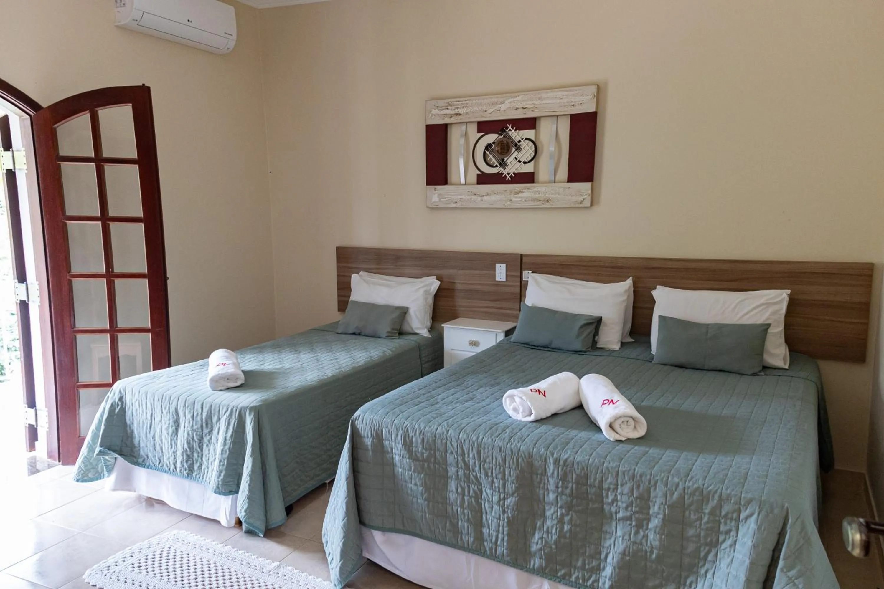 Bed in Pousada Nefelibatas