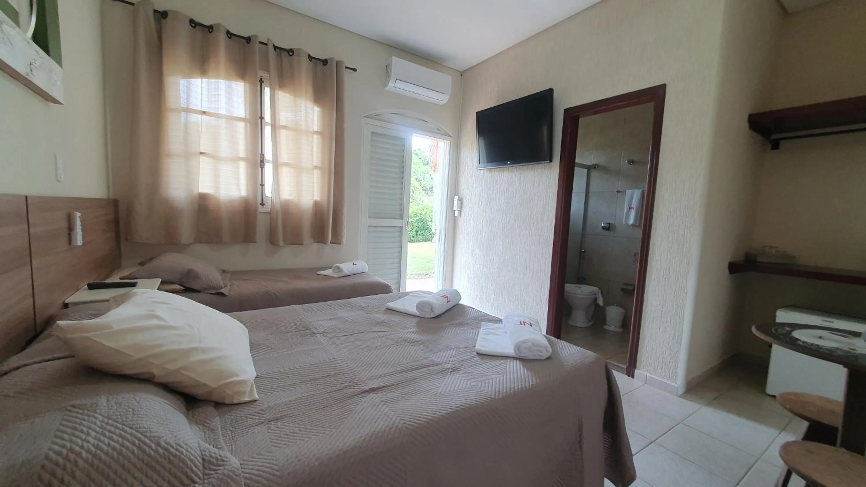 Bed in Pousada Nefelibatas