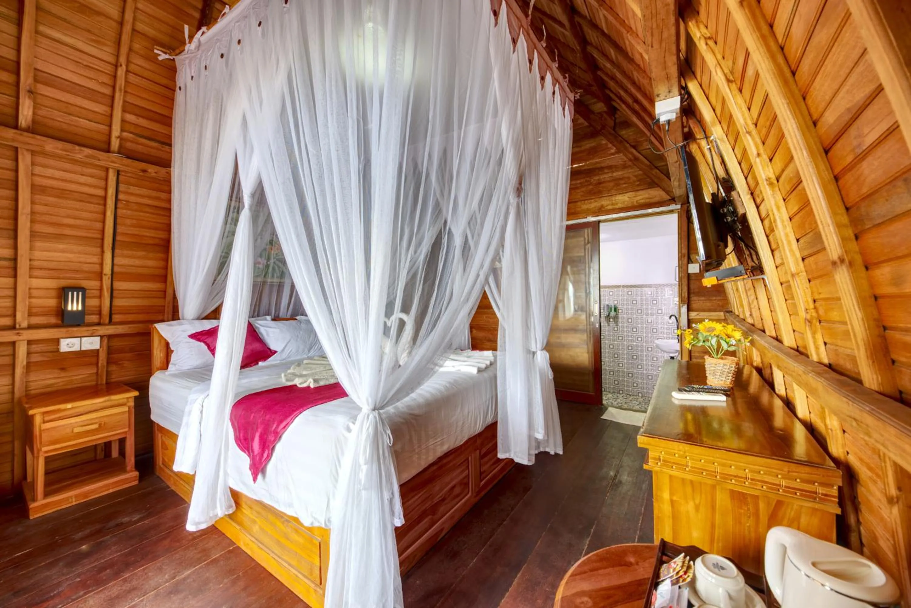 Bed in Santen Beach Bungalows