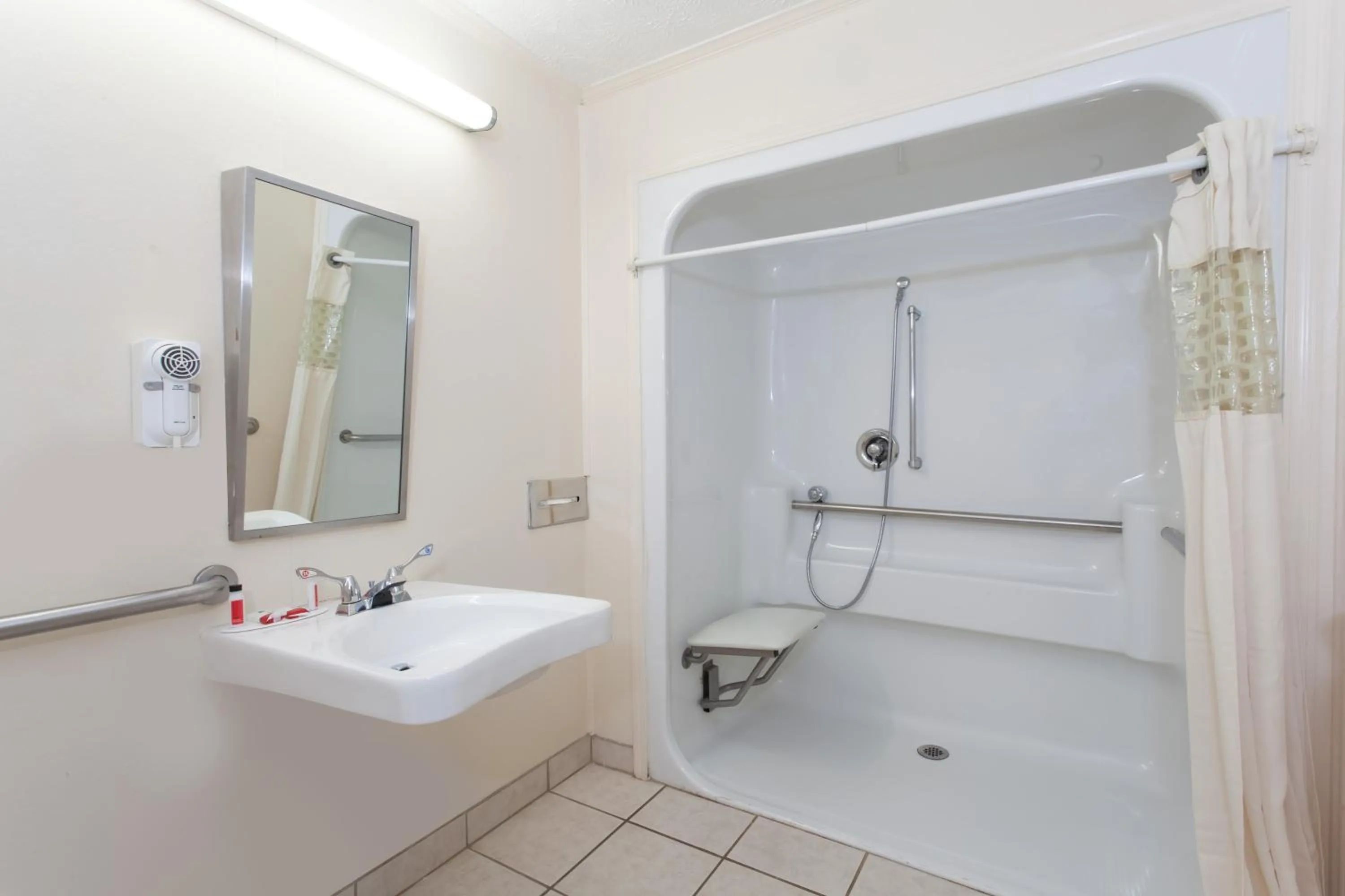 Bathroom in Executive East Syracuse Hotel