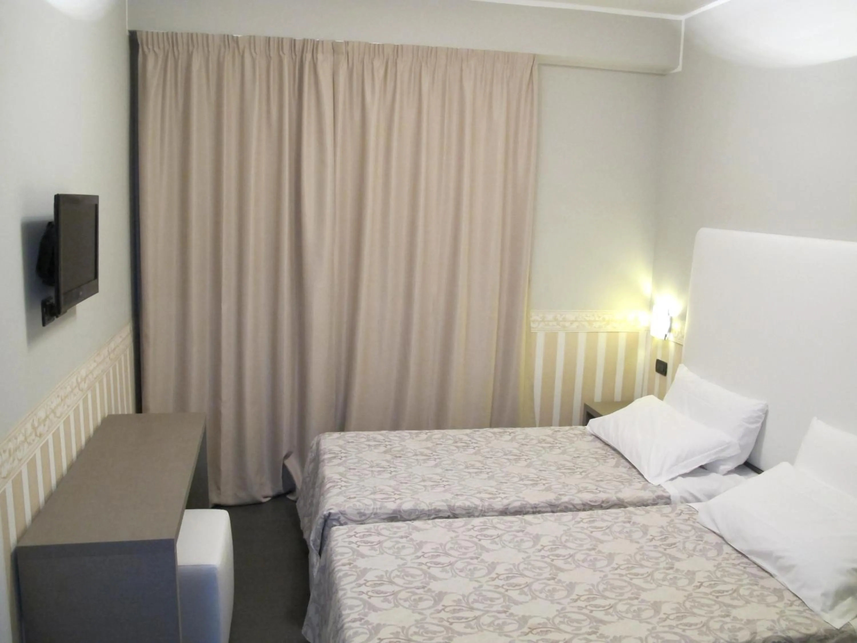 Bed in Hotel Laguna Residence